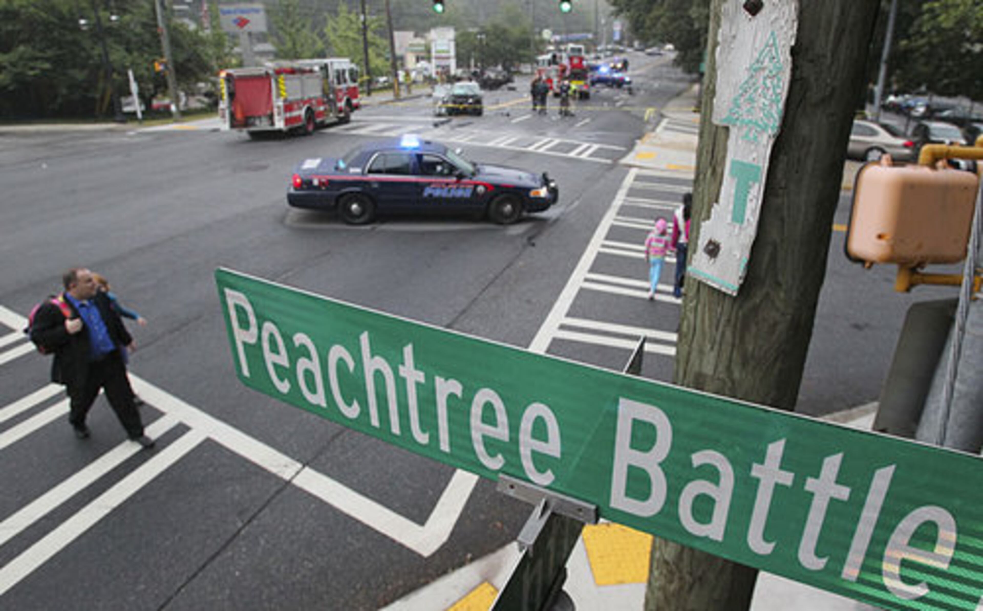 Parents walking their children to school got a look at a serious wreck during the Wednesday, Sept. 7, 2011 morning commute involving a motorist trapped inside an overturned vehicle on Peachtree Road at Peachtree Battle Avenue in Buckhead.