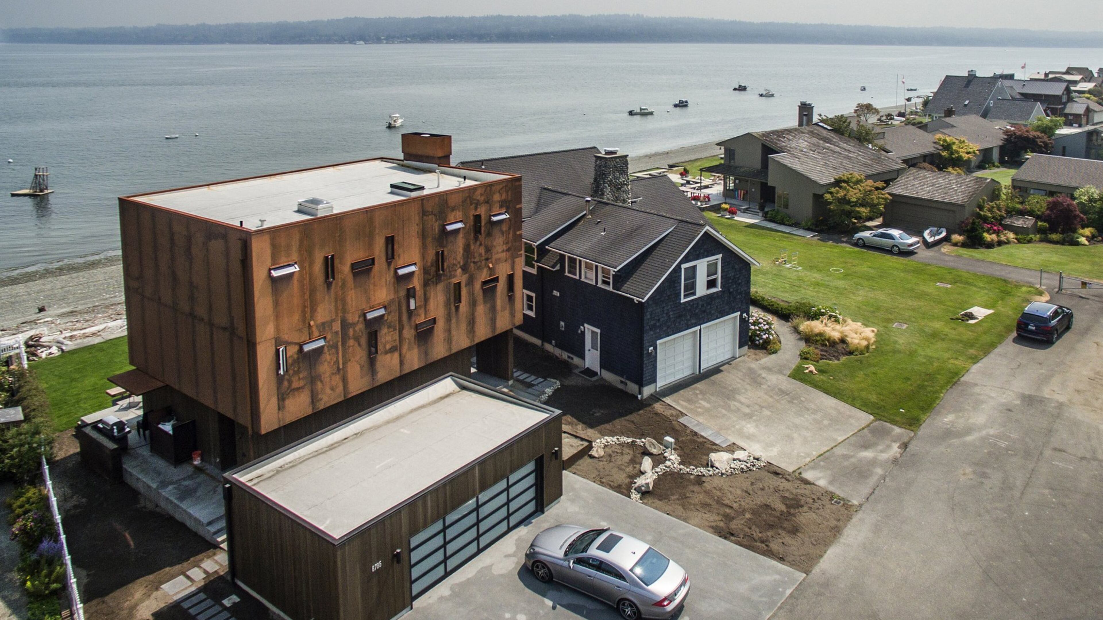 Every home in this photo is owned by members of Megan McMurray s family. The contemporary home on the left, designed by architect Erich Remash, belongs to Megan and her husband, Mike McMurray, and her sister and her family. Mike s father, Al McMurray, built the home. When my dad got the plans, he said, Can t you build something easier? Mike says. It was a challenging build. (Steve Ringman/Seattle Times/TNS)