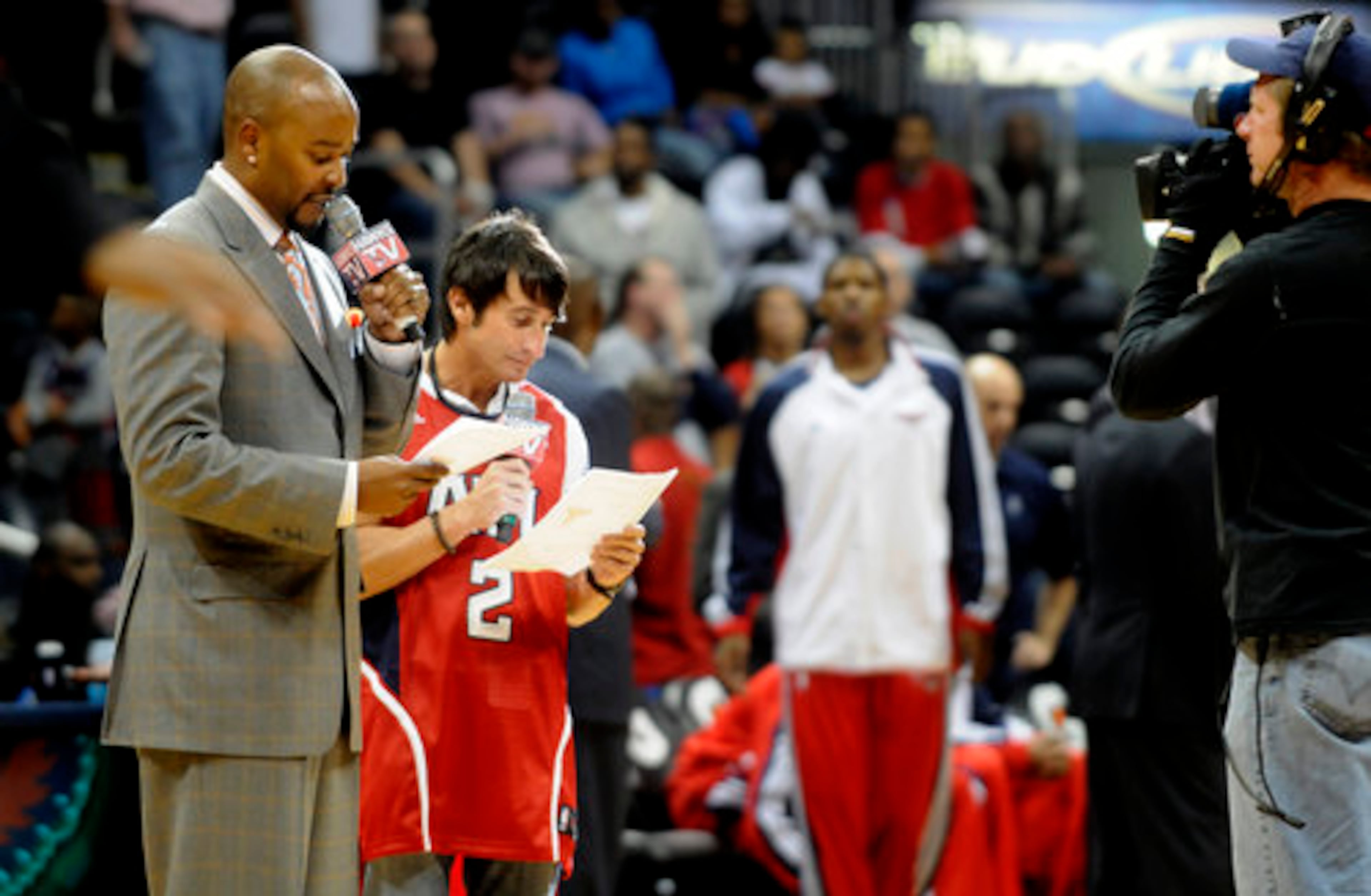 V-103 DJ Ryan Cameron and Q100 DJ Bert Weiss introduce the players before the Atlanta Hawks game in 2009.
