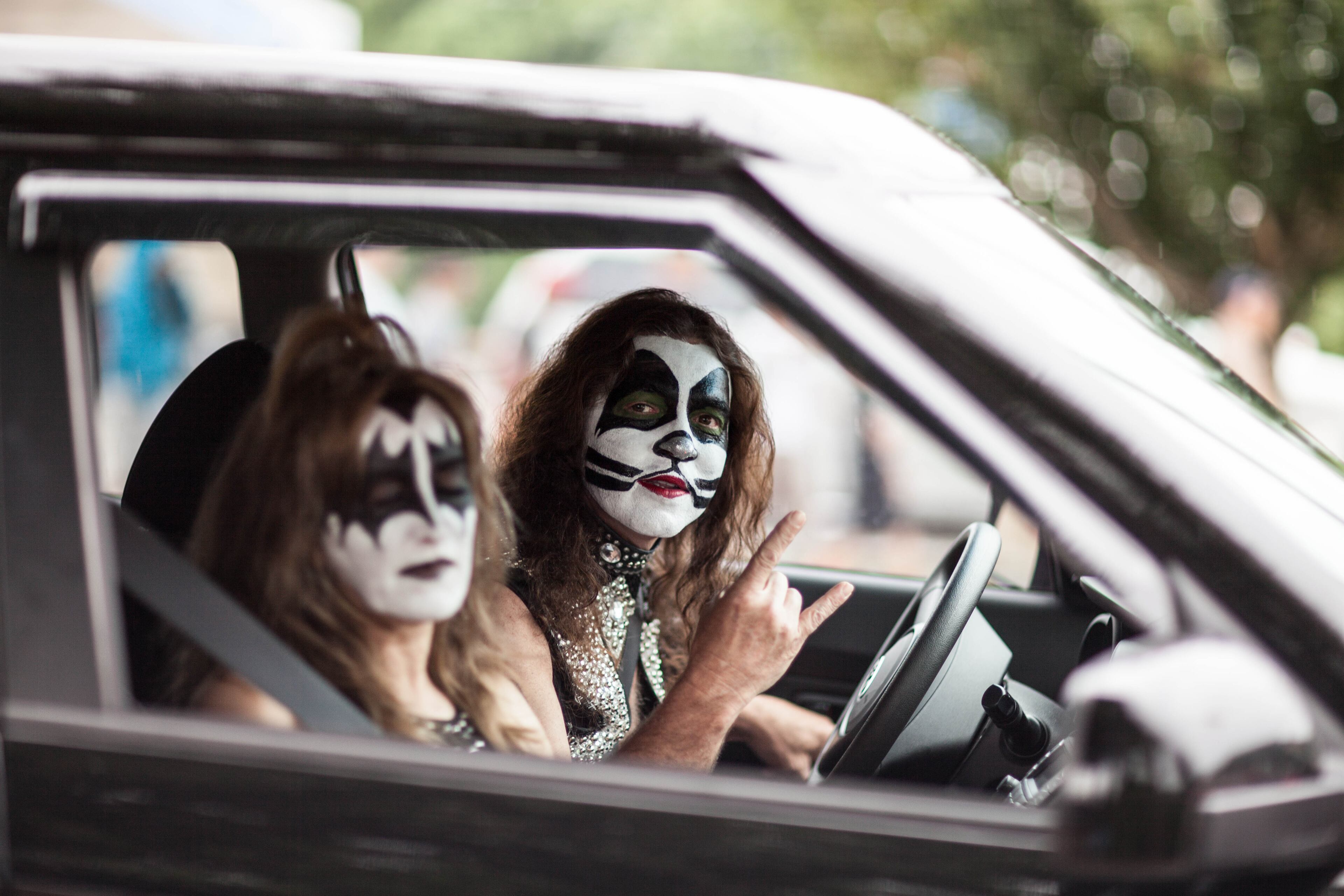 Fans dressed up as KISS members prepare to park at Aaron's Amphitheatre at Lakewood Friday, July 18, 2014 in Atlanta, Ga. KISS and Def Leppard made a stop in Atlanta during their 42-city North American tour.