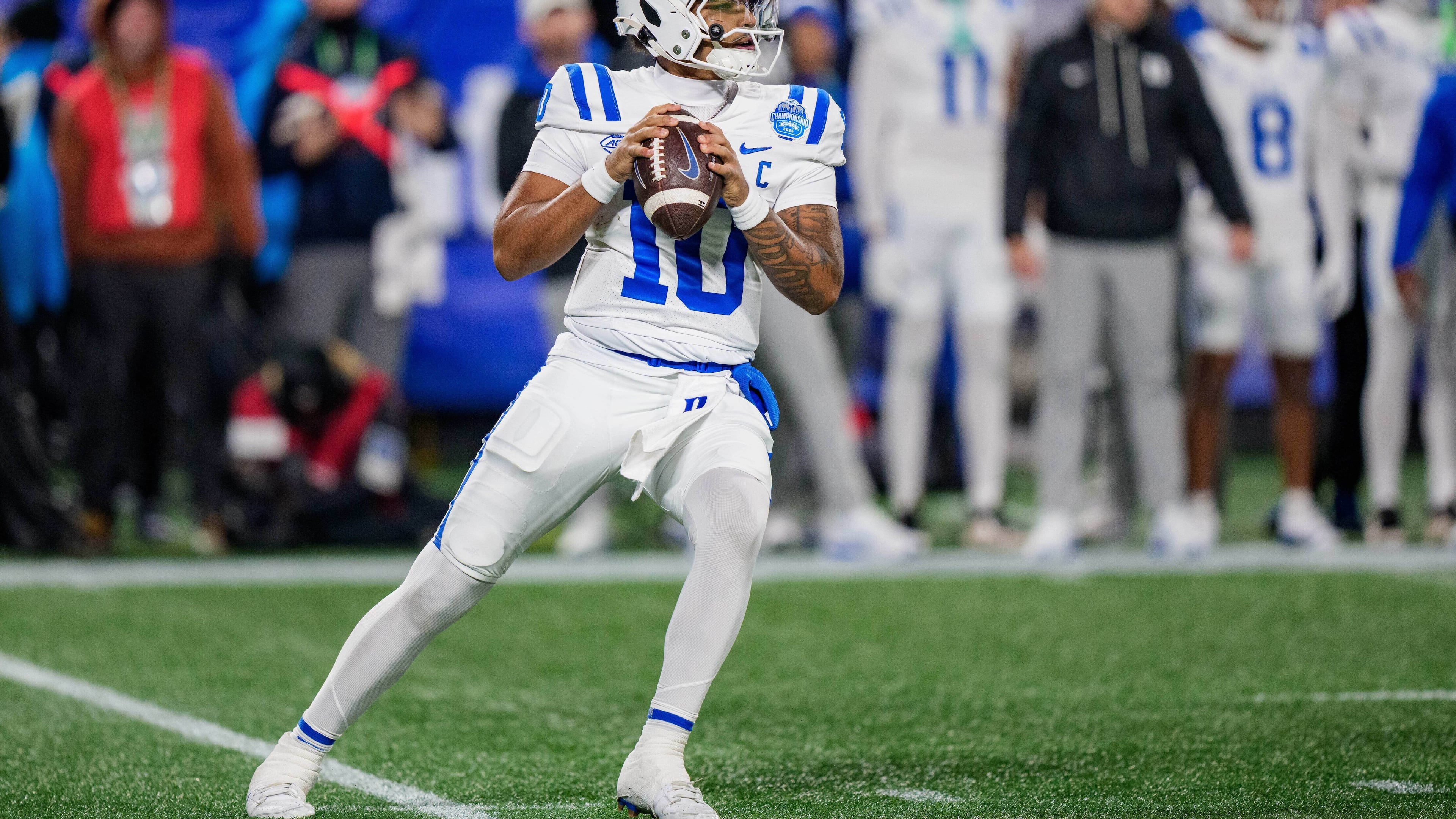 FILE - Duke quarterback Darian Mensah (10) drops back to pass during the Atlantic Coast Conference championship NCAA college football game between Virginia and Duke, Dec. 6, 2025, in Charlotte, N.C. (AP Photo/Jacob Kupferman, File)