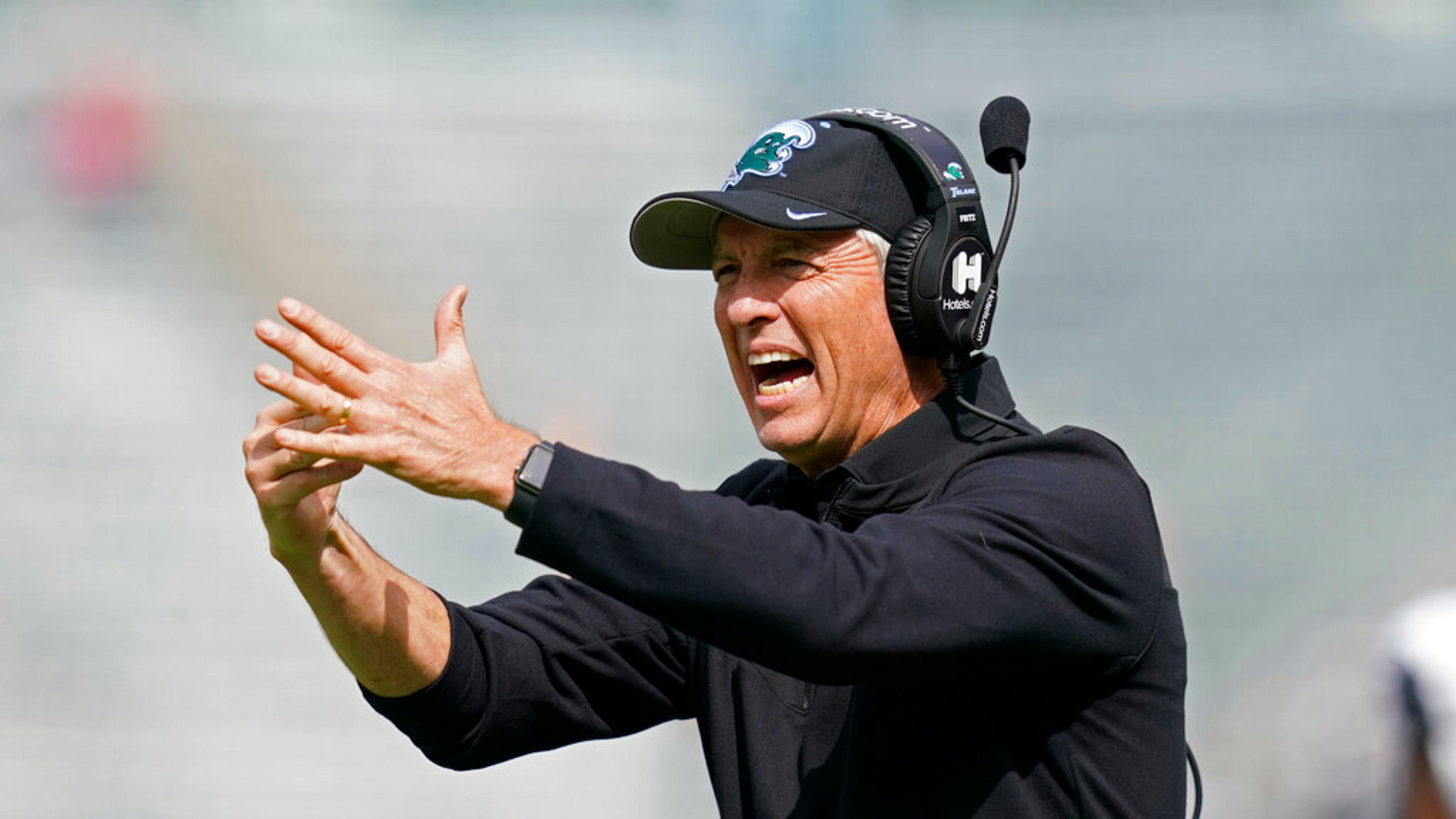 Tulane head coach Willie Fritz calls for a timeout during the first half of an NCAA college football game against Cincinnati in New Orleans, Saturday, Oct. 30, 2021. (AP Photo/Gerald Herbert)