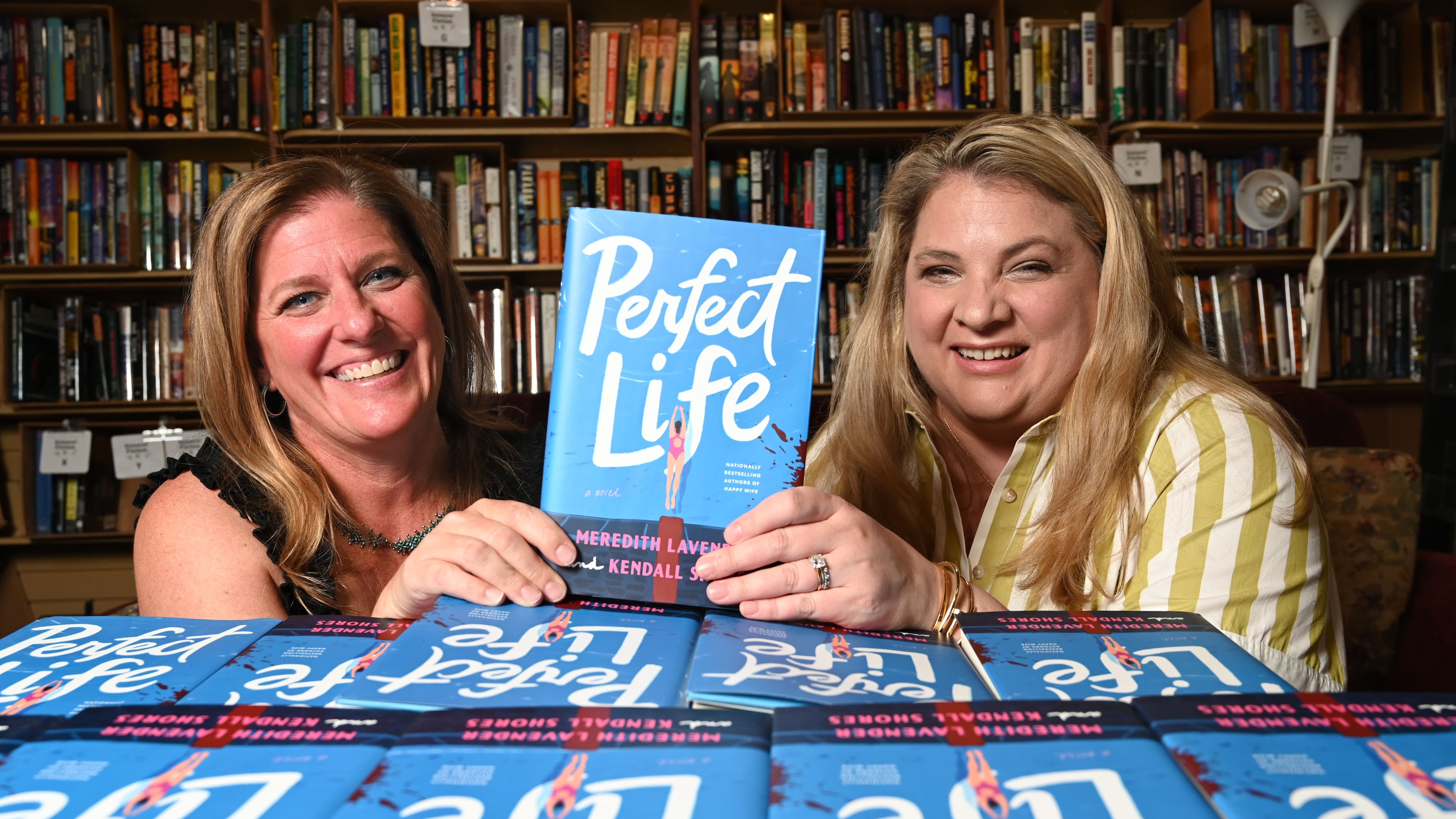 Meredith Lavender, left, and Kendall Shores, became friends first then co-authors. The latest book, "Perfect Life," published on July 7. (Hyosub Shin/AJC)