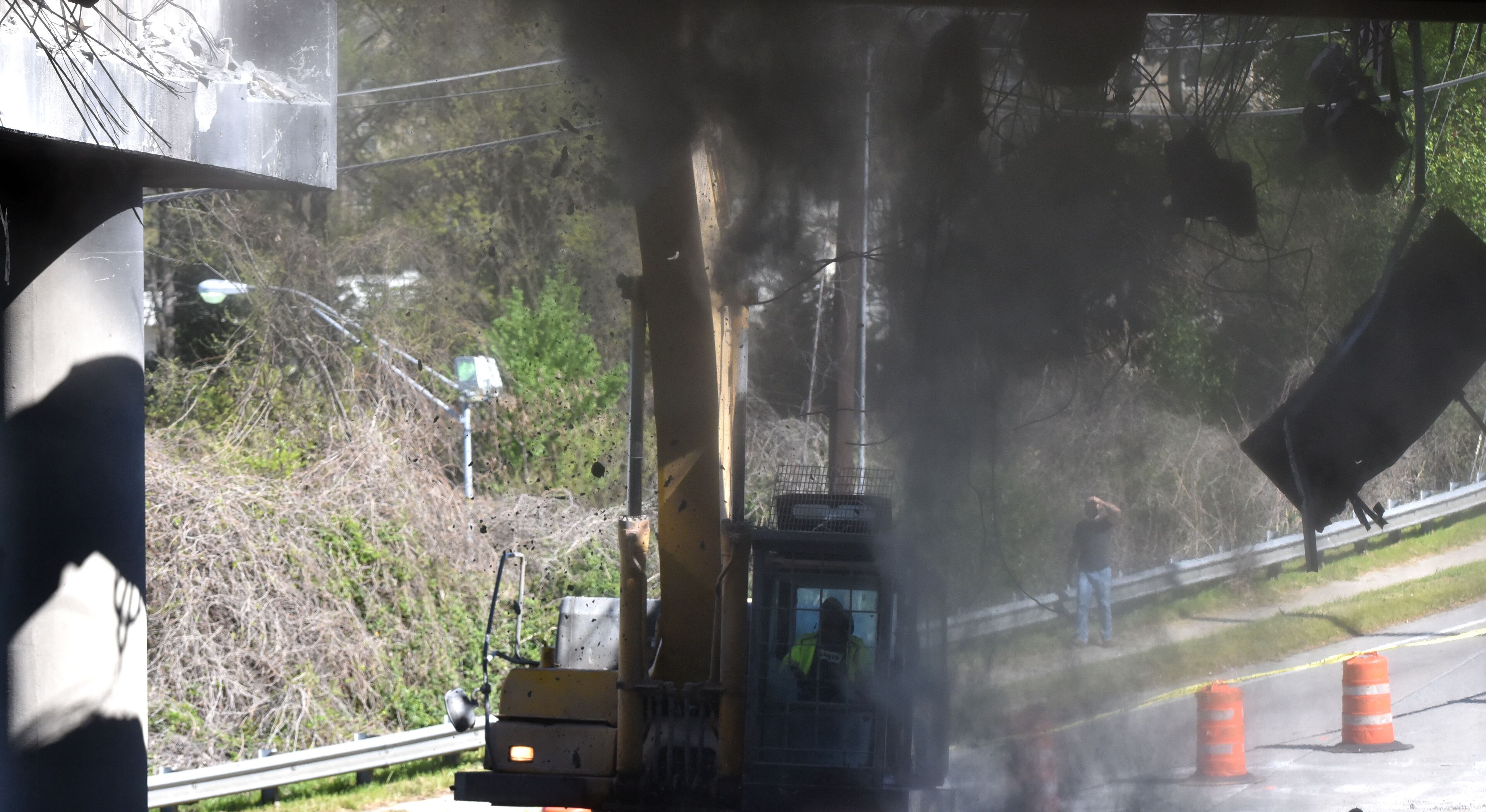 April 1, 2017 Atlanta - Crews demolish a damaged section of I-85 bridge structures on Saturday, April, 2017. Necessary work is continuing on the damaged sections of I-85 bridge structures. This includes demolition of the existing failed and damaged structures - which includes two 350-foot sections of interstate, one section each in both the northbound and southbound lanes, totaling approximately 700 feet - as well as all reconstruction activities. HYOSUB SHIN / HSHIN@AJC.COM