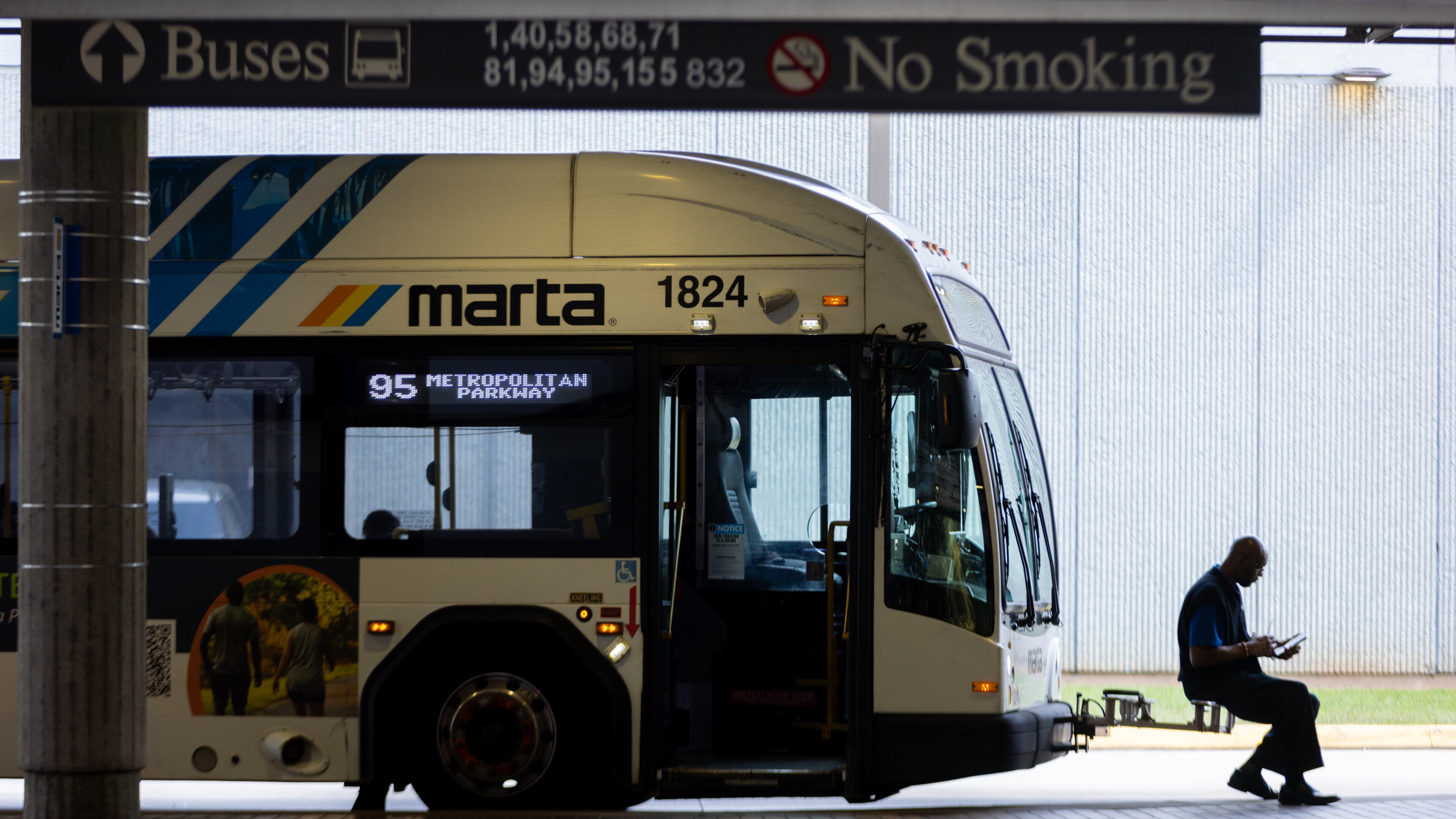 A bus driver waits at the West End MARTA station in Atlanta in September 2025. (Arvin Temkar/AJC)