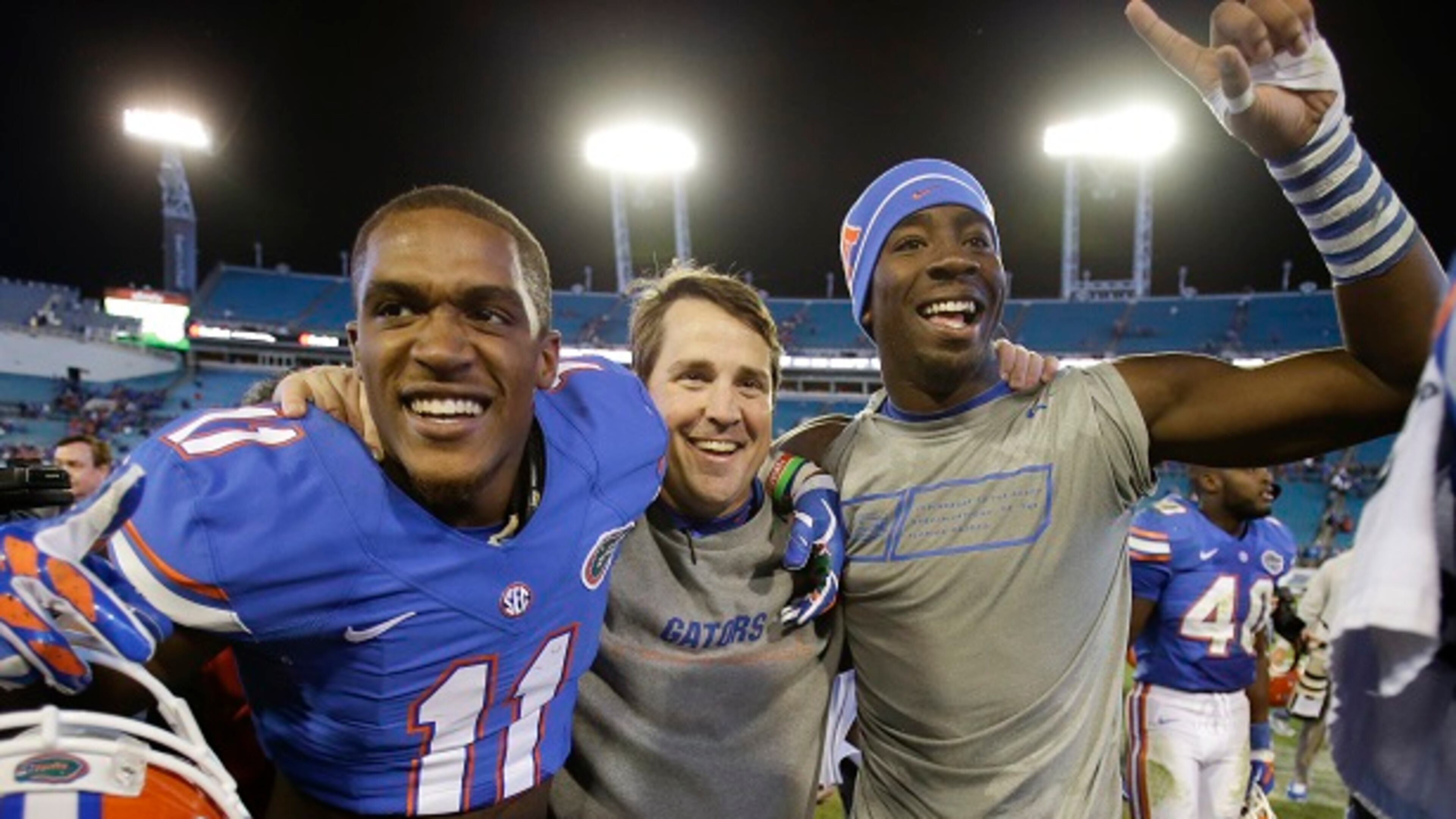 Florida head coach Will Muschamp, center, celebrates with players Demarcus Robinson (11) and Alex McCalister, right, after defeating Georgia 38-20 in an NCAA college football game in Jacksonville, Fla., Saturday, Nov. 1, 2014. (AP Photo/John Raoux) Will Muschamp after his one victory over Georgia. (John Raoux/AP photo)