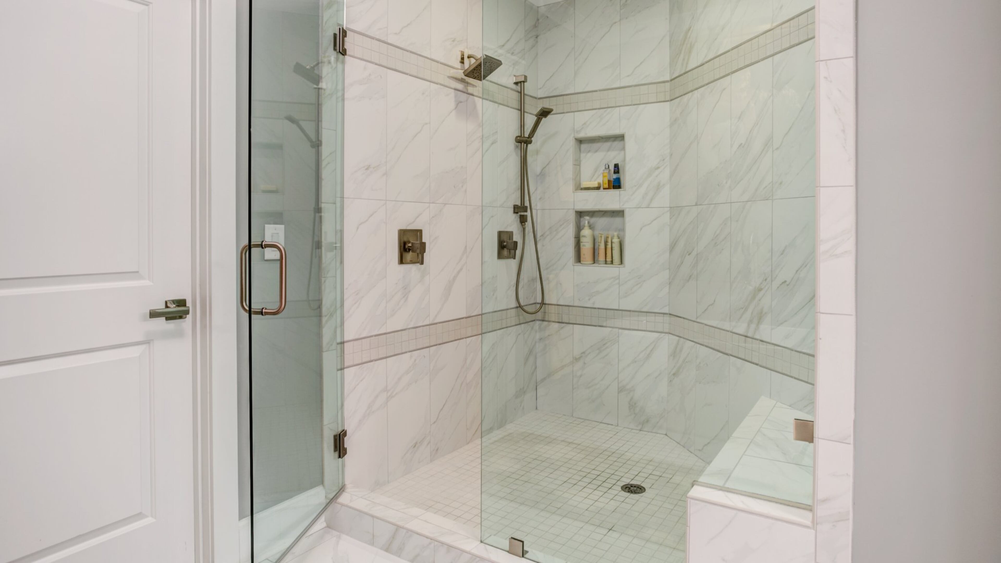 Spacious showers with niches and benches are replacing traditional bathtubs. Contributed by FrontDoor Communities