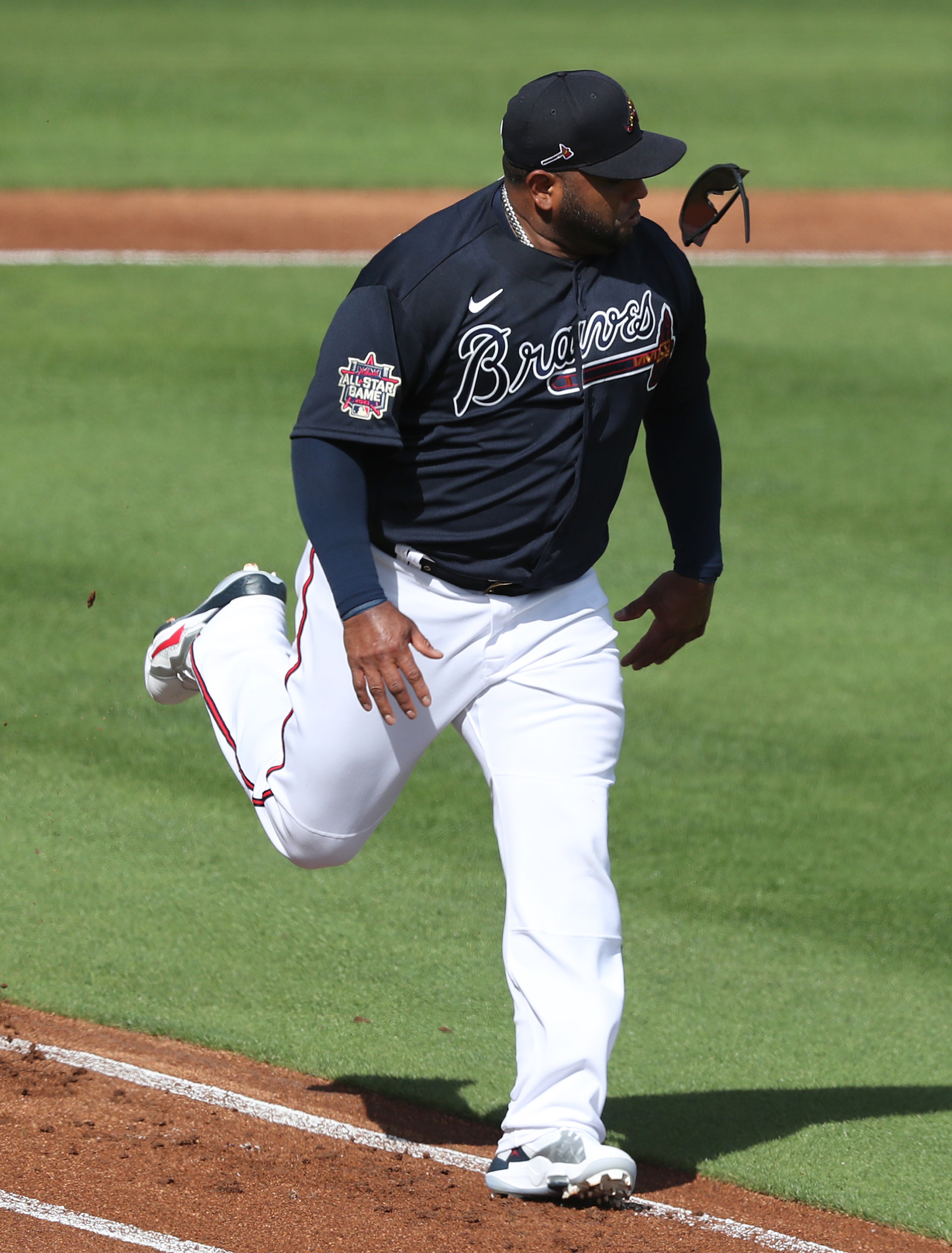 Braves infielder Pablo Sandoval loses his sunglasses during a base running drill down the first base line at team practice in CoolToday Park on Wednesday, Feb. 24, 2021, in North Port. Curtis Compton / Curtis.Compton@ajc.com”