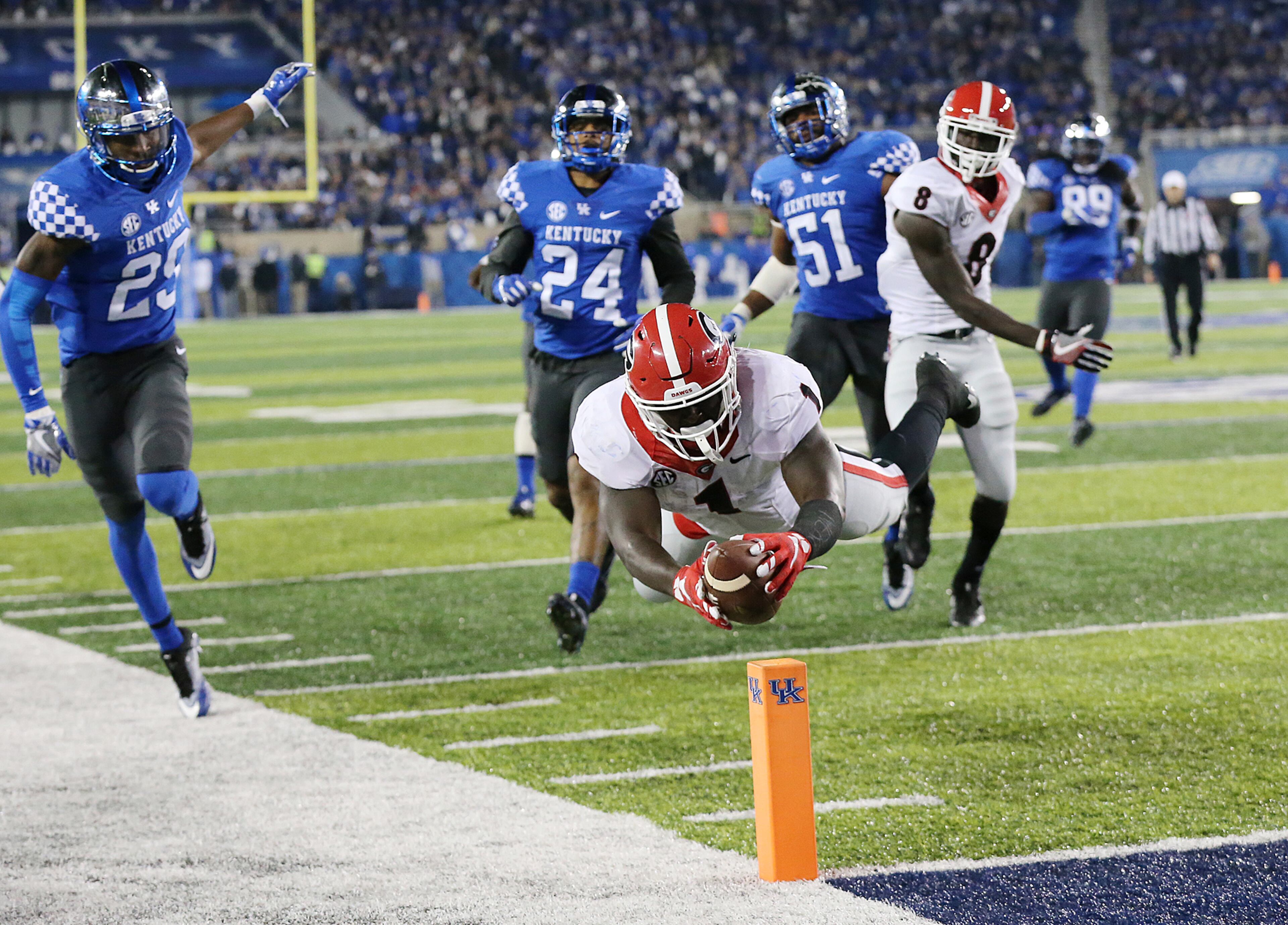 November 5, 2016, LEXINGTON: Georgia tailback Sony Michel just gets into the endzone for a touchdown against Kentucky in the fourth quarter of an NCAA college football game on Saturday, Nov. 5, 2016, in Lexington. Georgia made a two-point conversion after the score to take a 24-21 lead and went on to win the game 27-24. Curtis Compton /ccompton@ajc.com