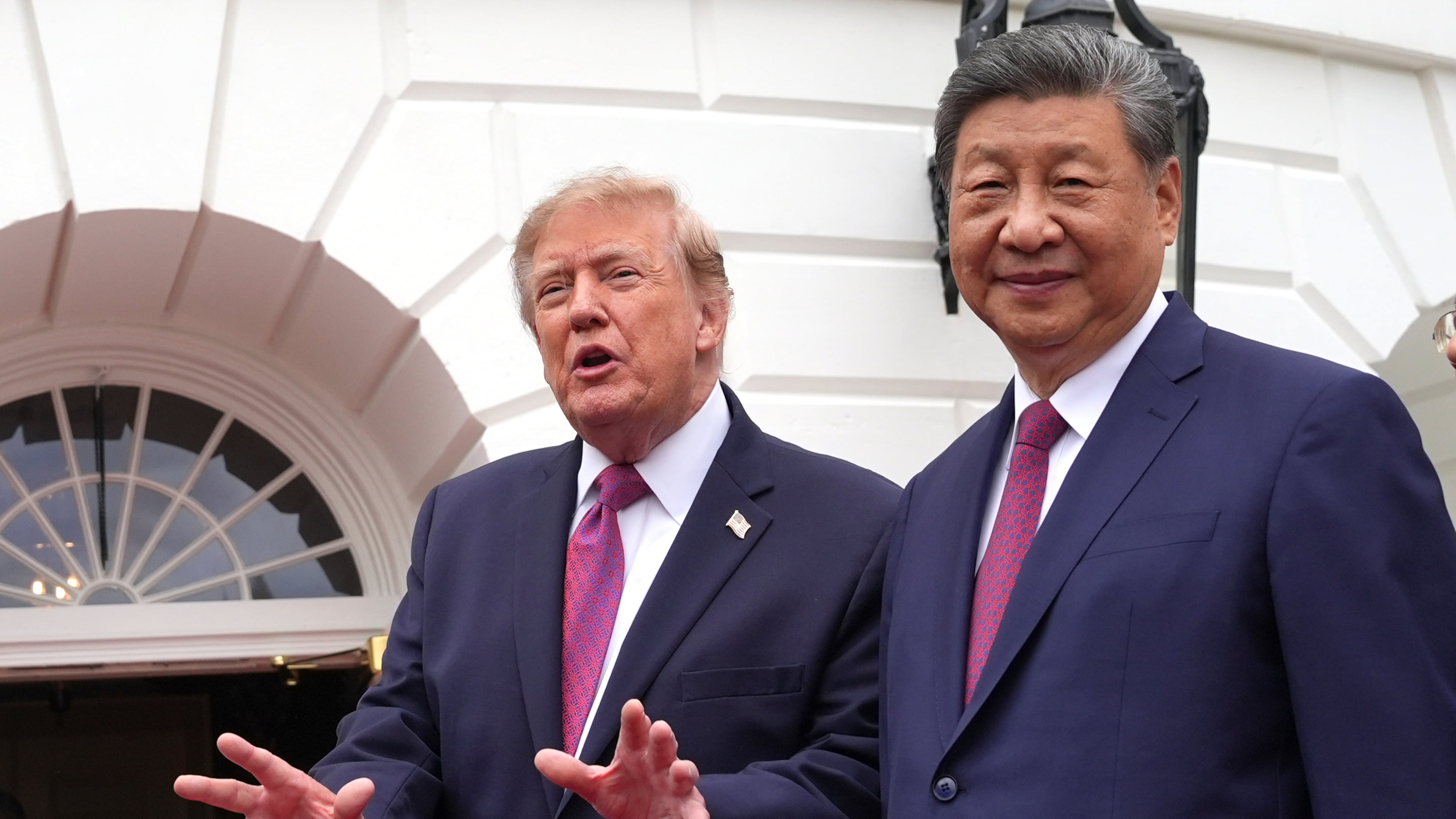 President Donald Trump, left, speaks to reporters during a tour of the South Lawn of the White House with China's President Xi Jinping, right, Thursday, Sept. 24, 2026, in Washington. (AP Photo/Alex Brandon)