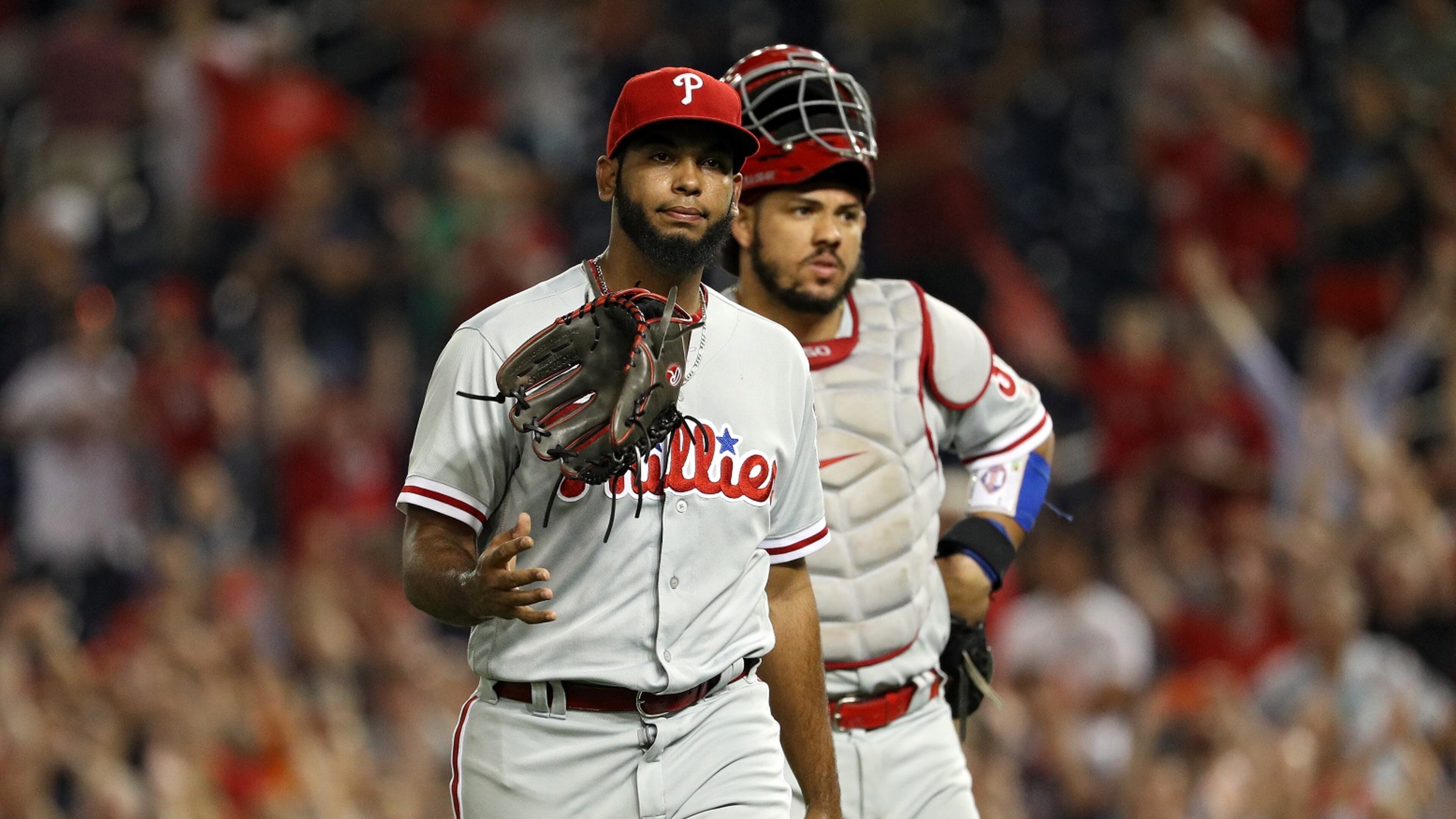 Pitcher Seranthony Dominguez #58 of the Philadelphia Phillies tosses his glove in the air as he walks off of the field after giving up a walk-off home run to Ryan Zimmerman #11 of the Washington Nationals (not pictured) during the ninth inning at Nationals Park on August 22, 2018 in Washington, DC. (Photo by Patrick Smith/Getty Images)