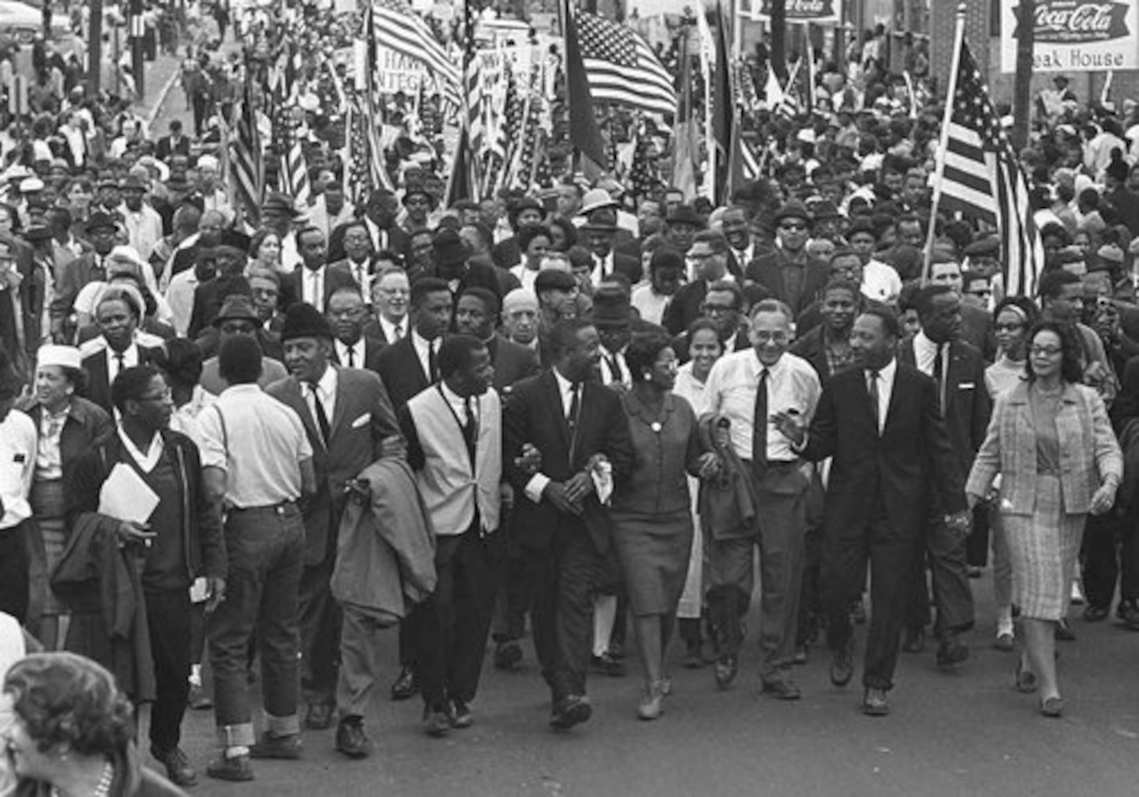 Civil rights marchers stream across the Alabama River in this March 21, 1965, file photo on the first of a five-day, 50-mile march to the state capitol at Montgomery. Dr. Martin Luther King holds hands with his wife, Coretta Scott King, right foreground, during the march. Saturday, April 4, 1998, marks the 30th anniversary of Dr. King's assassination.