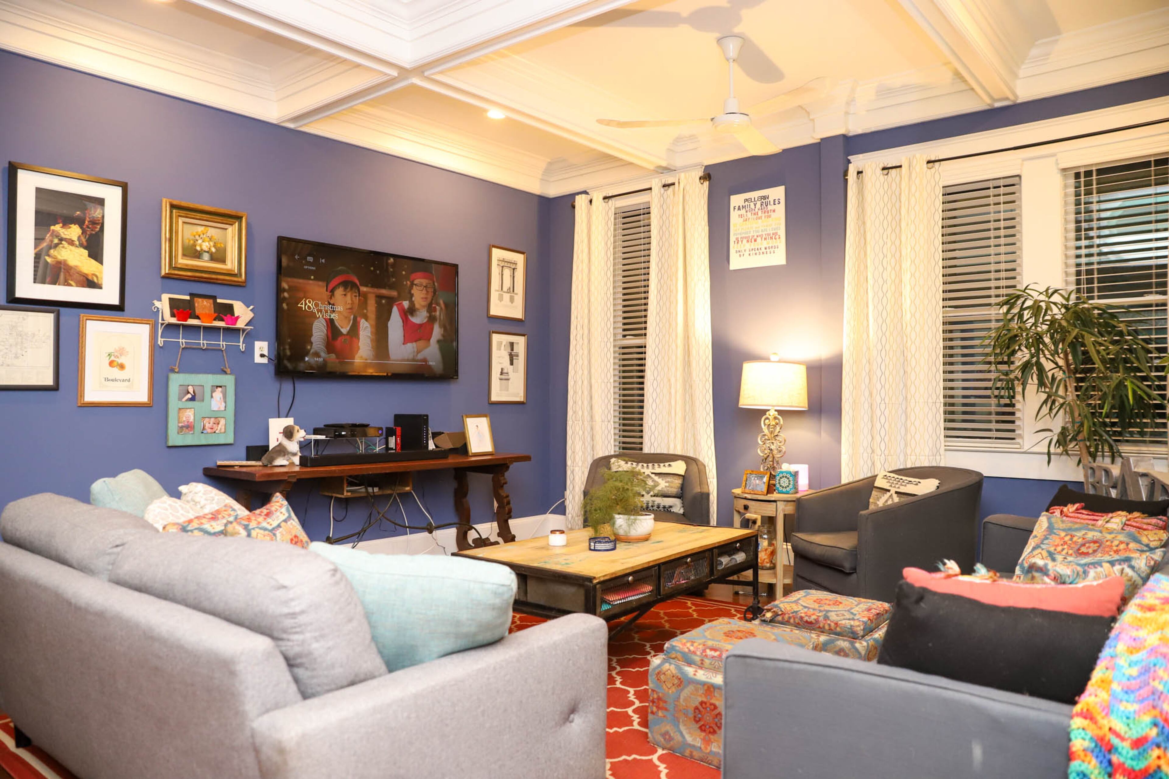 The gallery wall in Philippe and Amanda Pellerin’s home is was put together with the help of Home Staging Love, and has some of the family’s favorite pieces in it. The gallery wall includes family photos, a ship painted by Philippe’s dad, a WWI era cuckoo clock and a restaurant menu reading “Boulevard” collected by Amanda’s aunt. Text by Shannon Dominy. Photo by Reynolds Rogers.