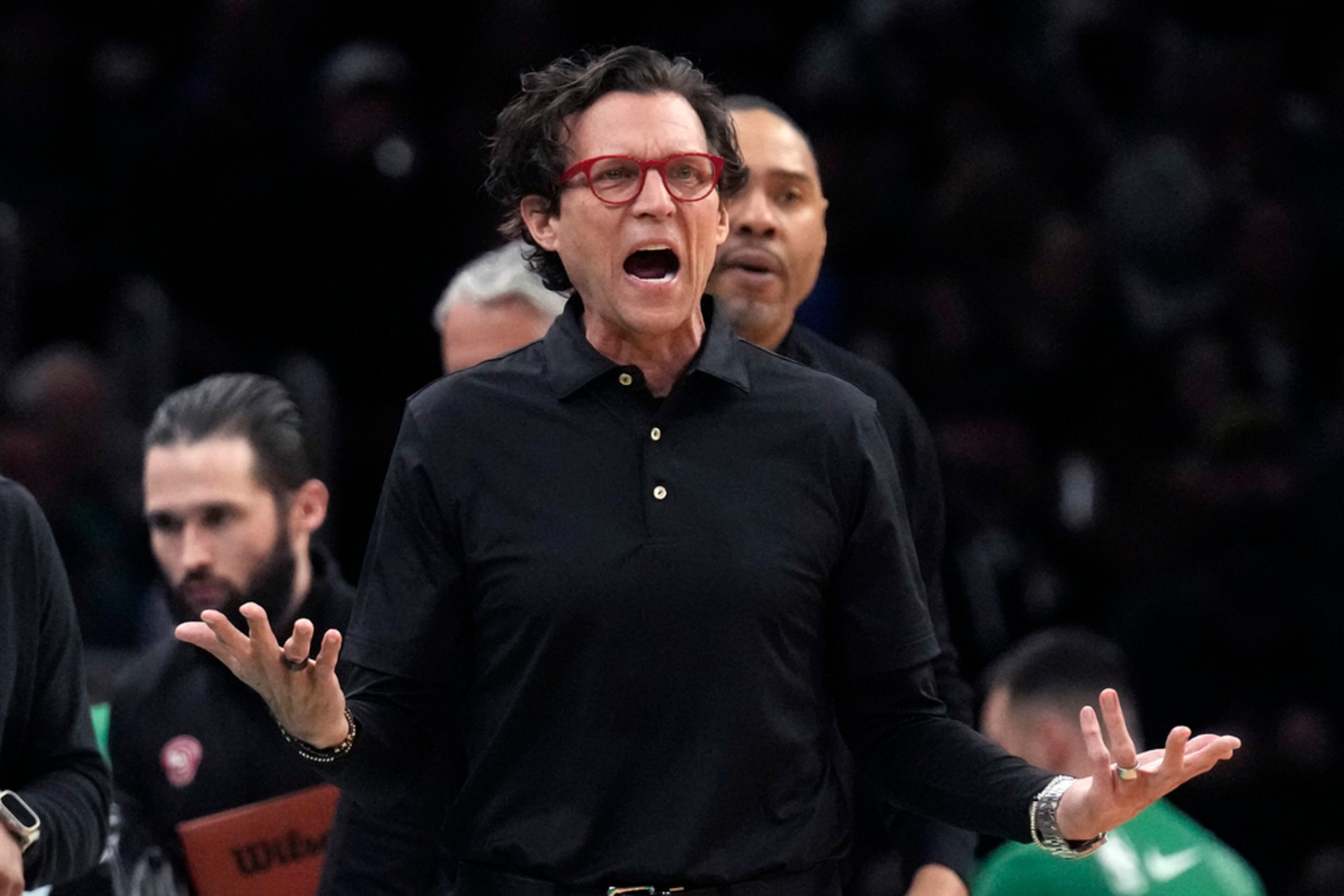 Atlanta Hawks coach Quin Snyder calls to officials during the first half of the team's NBA basketball game against the Boston Celtics, Wednesday, Feb. 7, 2024, in Boston. (AP Photo/Charles Krupa)