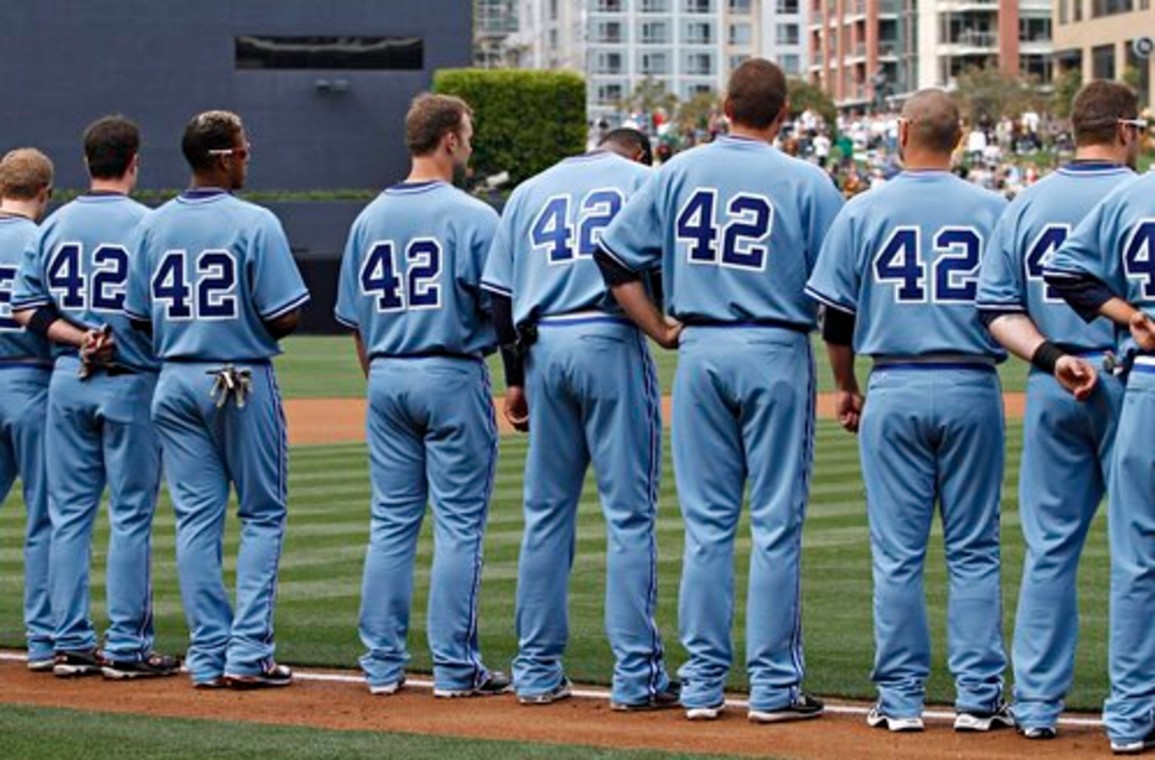Braves players line up before the start of a baseball game against the San Diego Padres, Thursday, April 15, 2010, in San Diego. Players from both the Braves and the Padres wore No. 42 in honor of Jackie Robinson and retro uniforms as part of a "Throwback Thursdays" promotion.