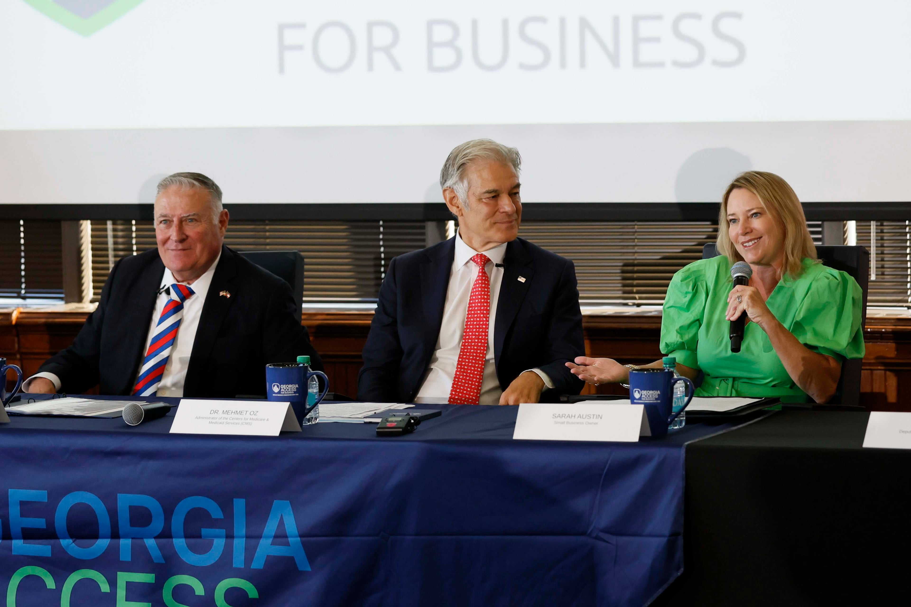 Small business owner Sarah Austin, right, speaks alongside Medicare & Medicaid Services Administrator Dr. Mehmet Oz, center, and Georgia Insurance and Safety Fire Commissioner John King during a roundtable on Monday with health leaders in Atlanta. (Miguel Martinez/AJC)