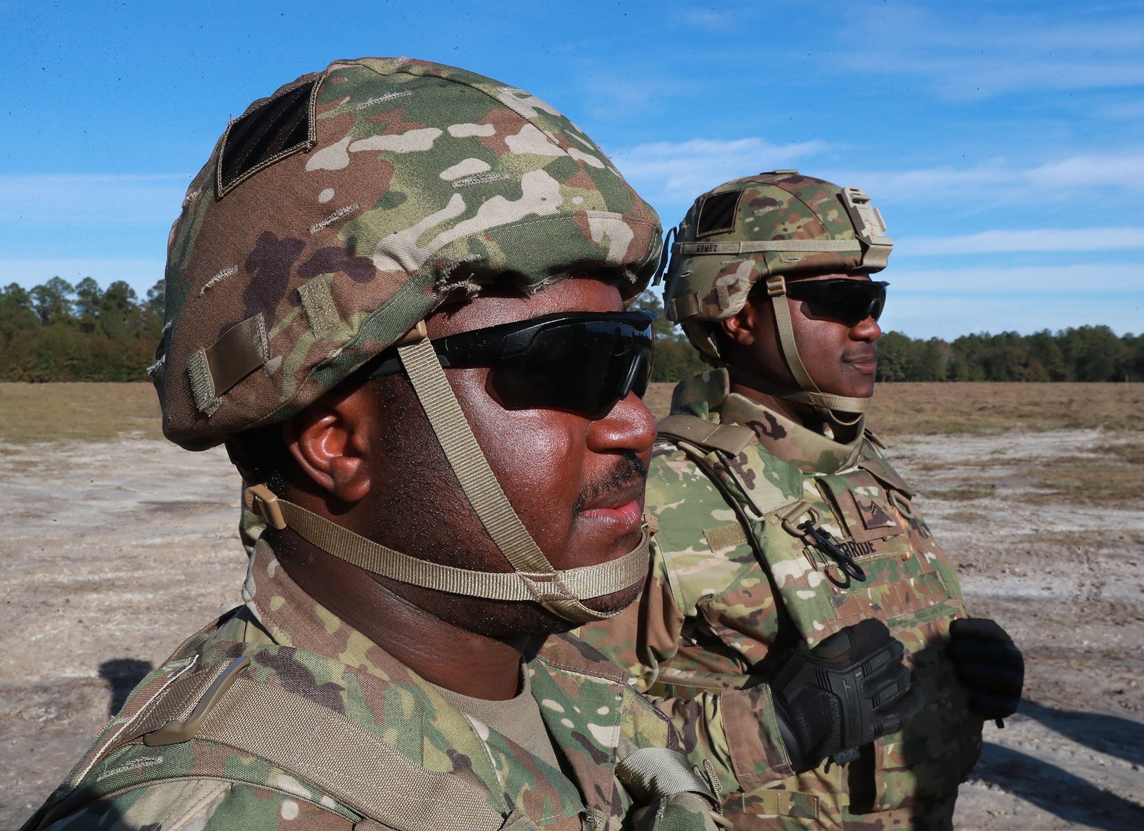 Fraternal twins Ryan (left) and Matthew McBride during training exercises in December at Fort Stewart ahead of a nine-month deployment to Afghanistan to train that nation’s security forces. Curtis Compton/ccompton@ajc.com