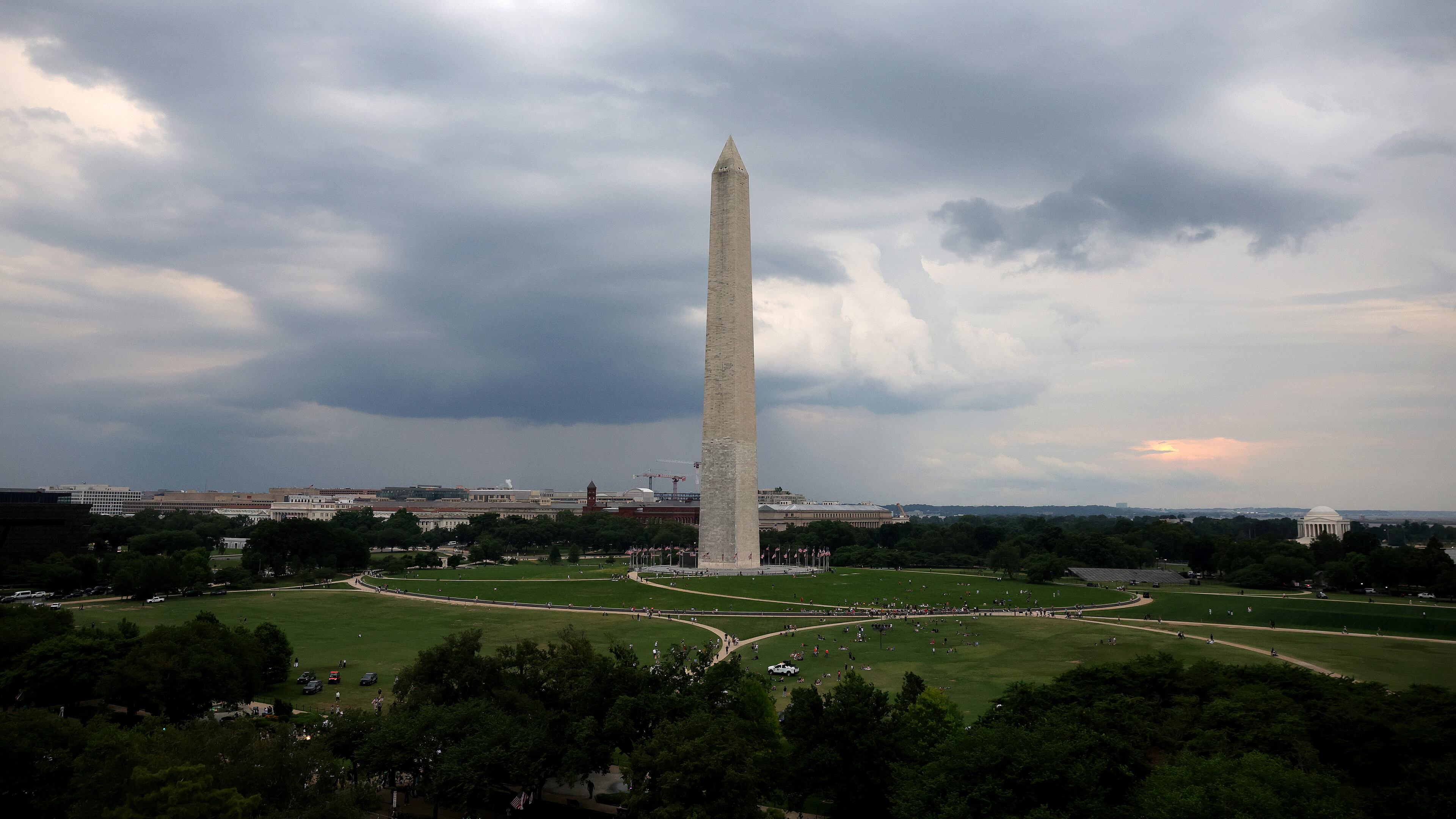 Storm clouds move above the Washington Monument ahead of the UFC Freedom 250 fight on the South Lawn of the White House on Sunday, June 14, 2026, in Washington. (Kevin Dietsch/Pool Photo via AP)