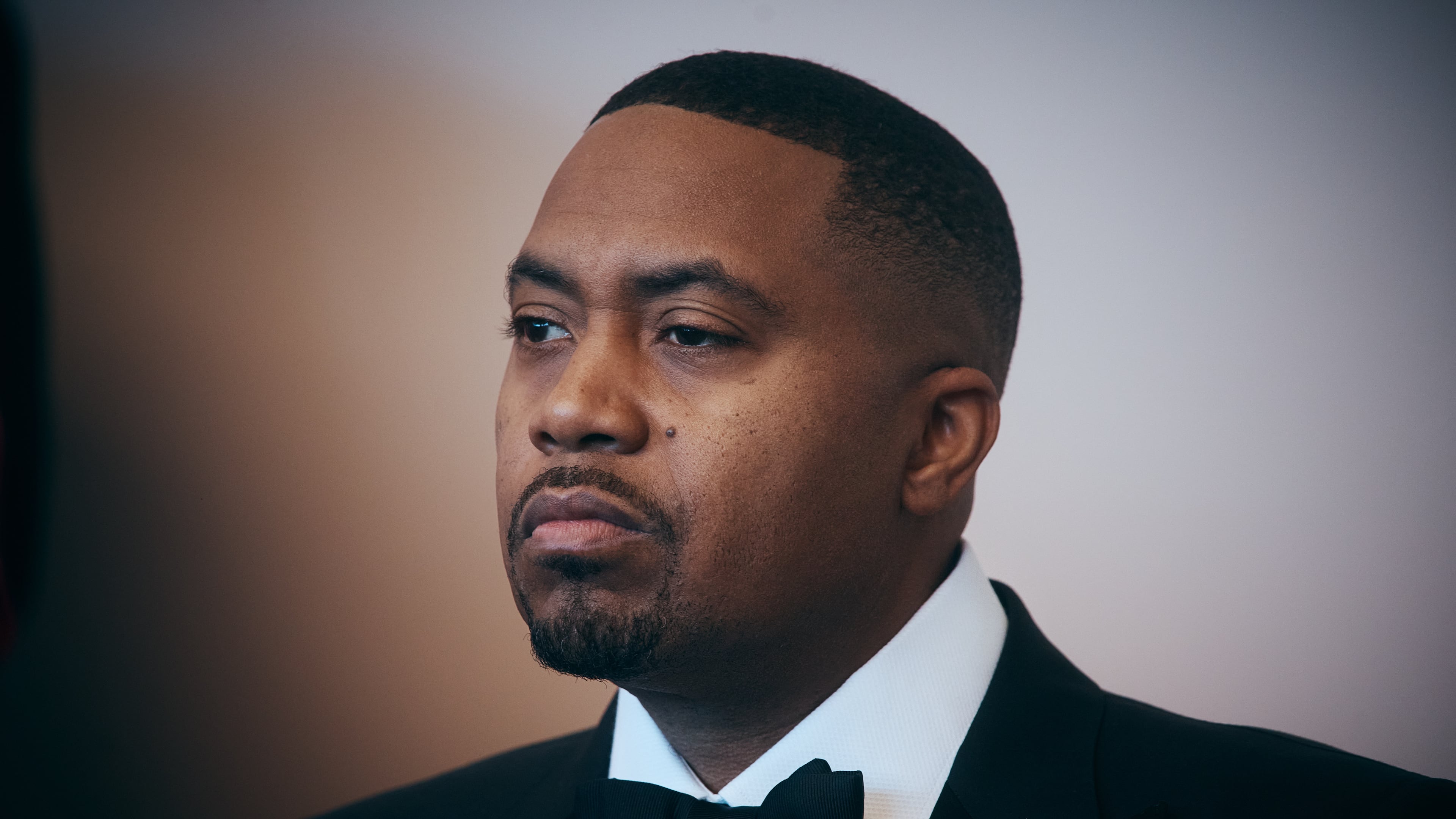 FILE - Rapper Nas listens to a speaker during the opening of live table games at Resorts World New York City on April 28, 2026, in New York. (AP Photo/Andres Kudacki, File)