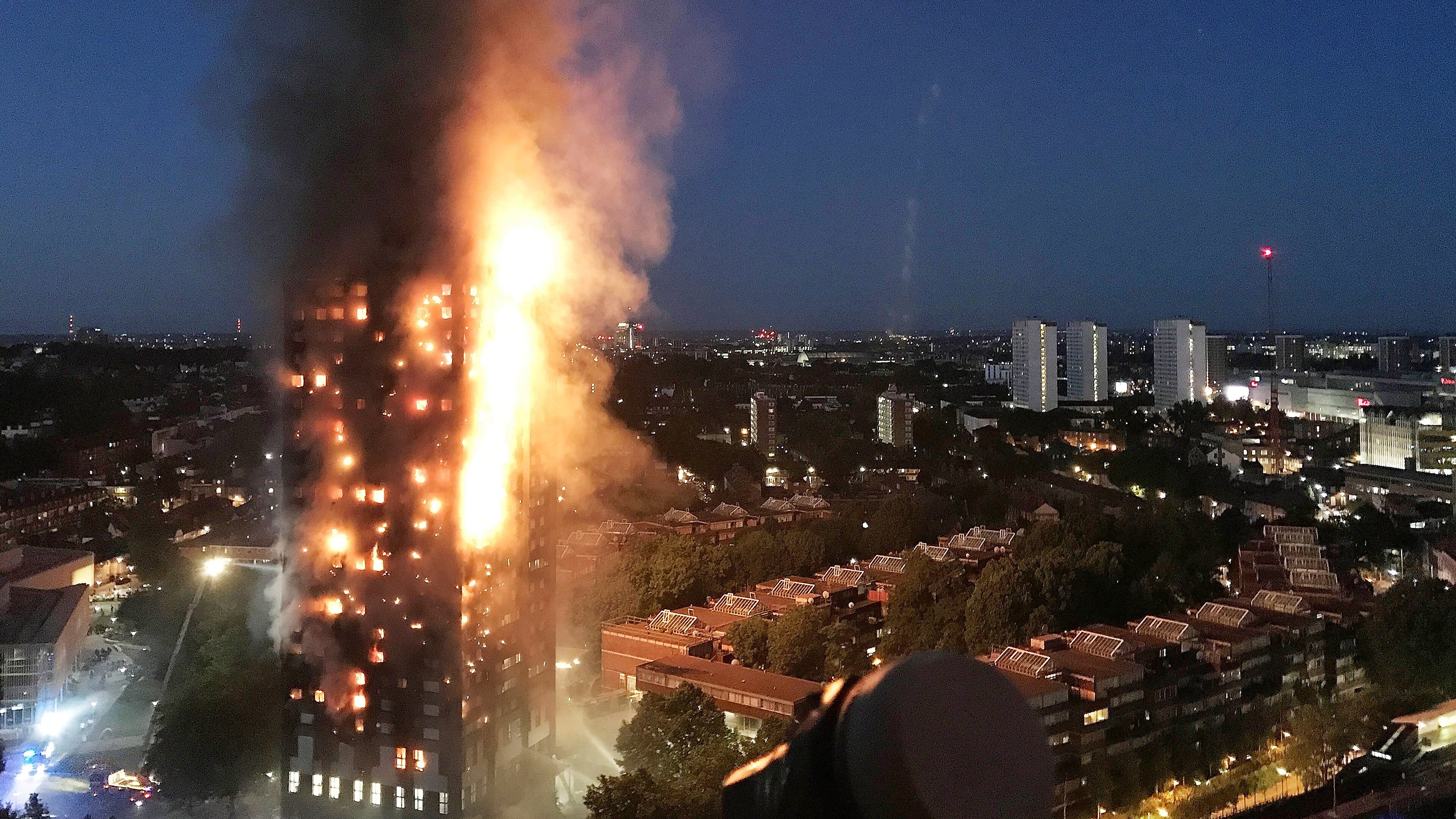 A fire engulfs the 24-story Grenfell Tower in London on Jun 14. At least 80 people died in the blaze that’s been blammed on flammable building material added in a renovation. (Photo by Gurbuz Binici /Getty Images)