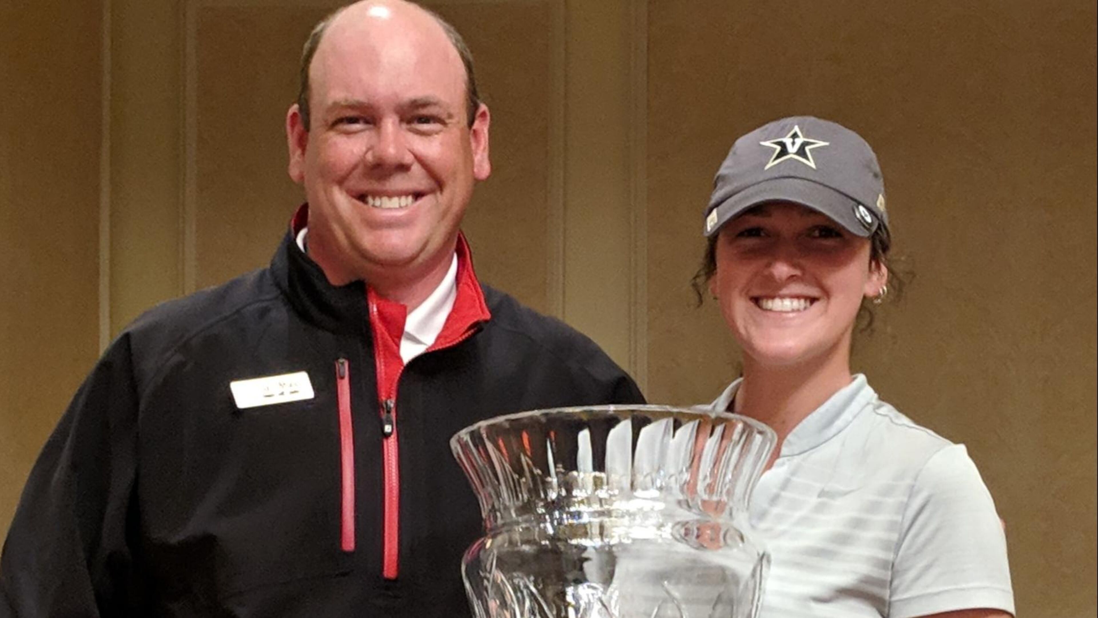 Tess Davenport is congratulated by Atlanta Athletic Club professional and tournament director Chris Moore.