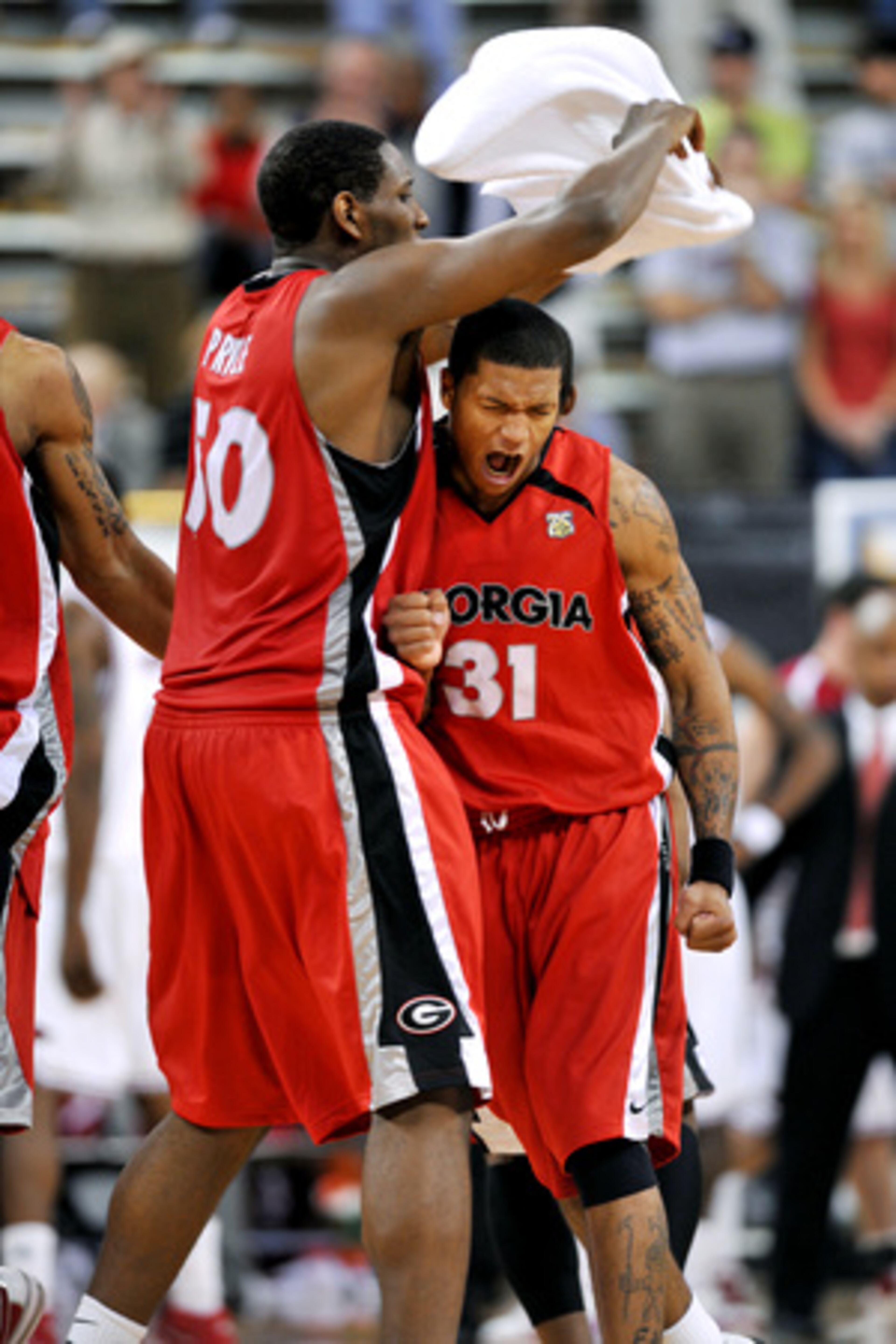 Humphrey (31) celebrates with teammate Jeremy Price after hitting the three.