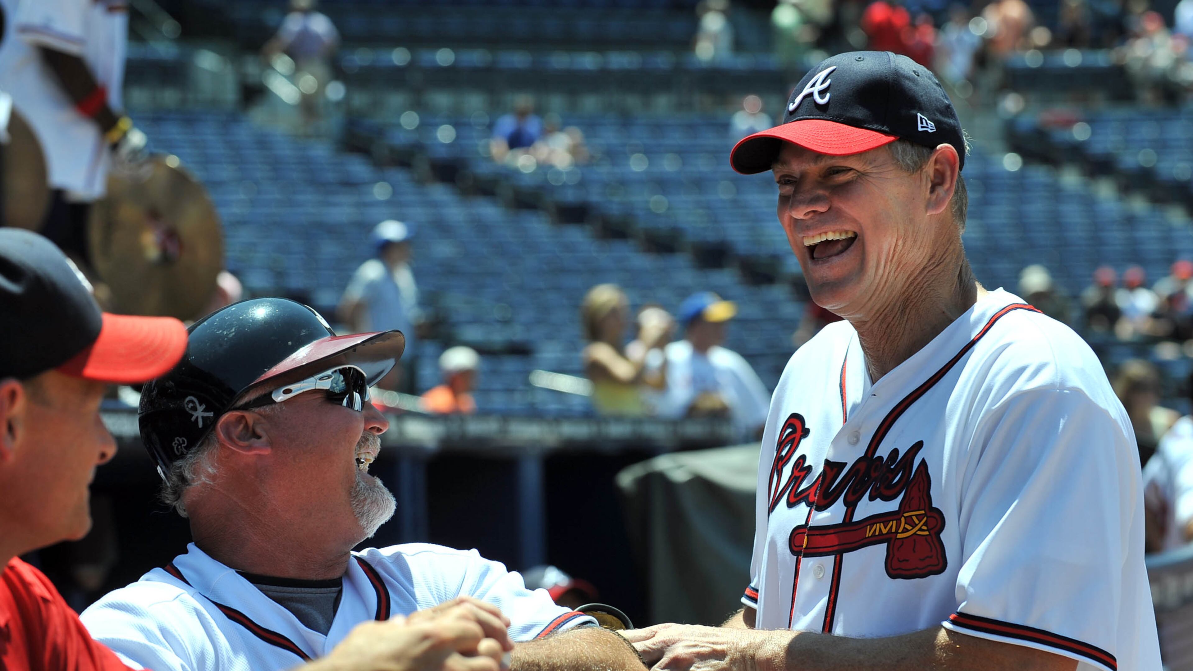 100626 Atlanta : Murphy's MVP's captain Dale Murphy (right) and Braves coach Glee Hubbard share a laugh during the Celebrity-Alumni Softball Classic at Turner Field. The Atlanta Braves hosts their first Celebrity-Alumni Softball Classic before the Braves take on the Detoit Tigers on Saturday at Turner Field in Atlatan. Saturday, June 26, 2010 Hyosub Shin hshin@ajc.com Dale Murphy remains a popular figure at Braves games (Hyosub Shin/AJC)