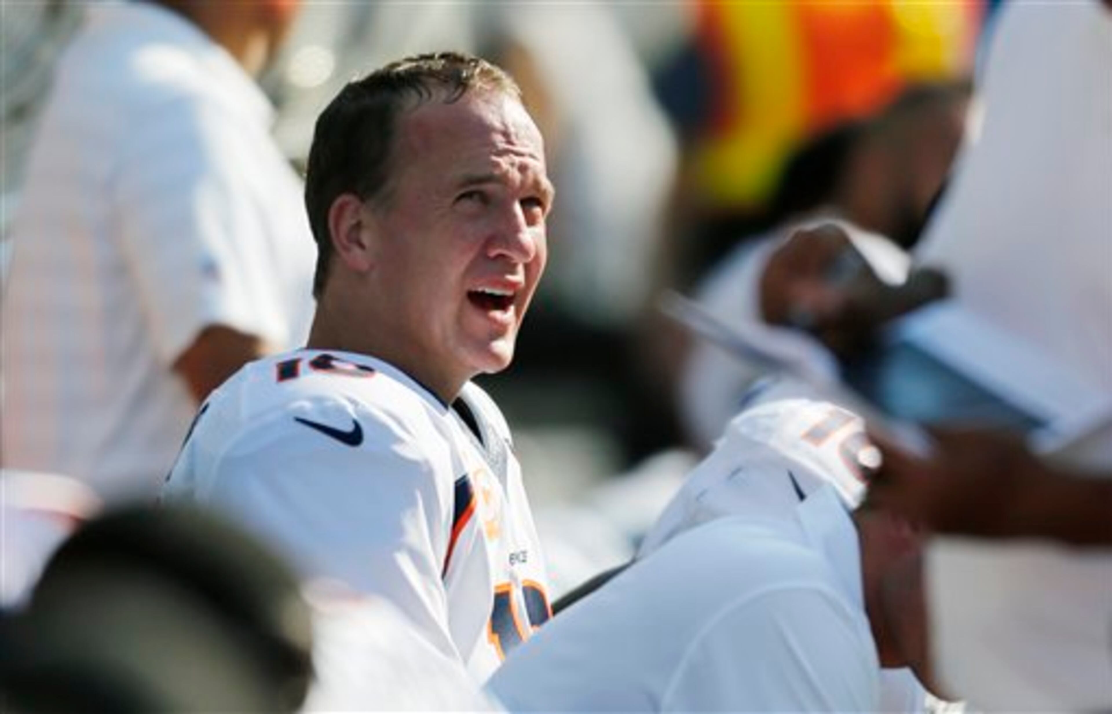 Denver Broncos quarterback Peyton Manning sits on the bench late in the second half of an NFL football game against the Seattle Seahawks, Sunday, Sept. 21, 2014, in Seattle. The Seahawks beat the Broncos 26-20 in overtime. (AP Photo/John Froschauer)