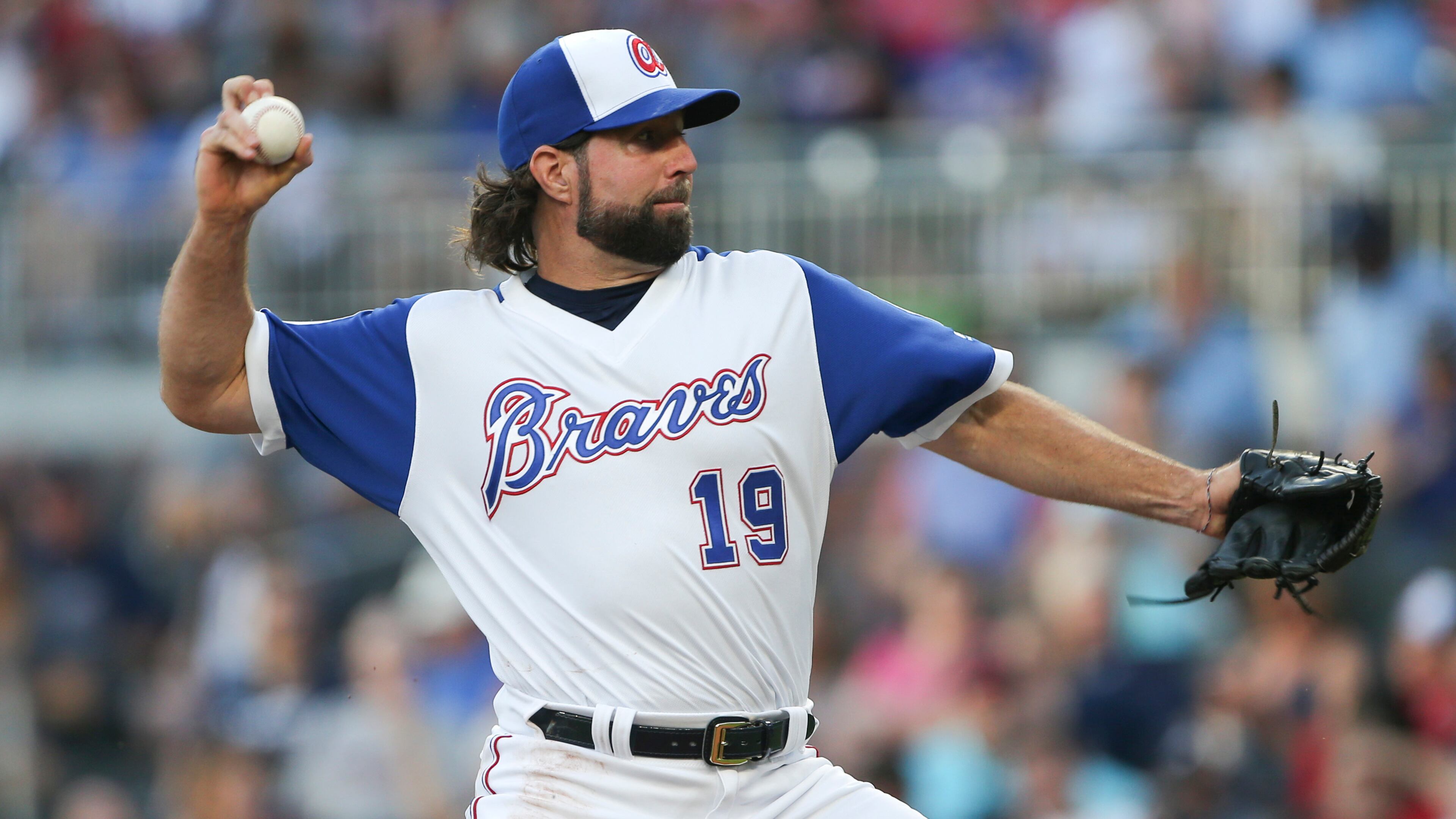 Atlanta Braves starting pitcher R.A. Dickey works in the first inning of the team's baseball game against the Cincinnati Reds on Friday, Aug. 18, 2017, in Atlanta. (AP Photo/John Bazemore)