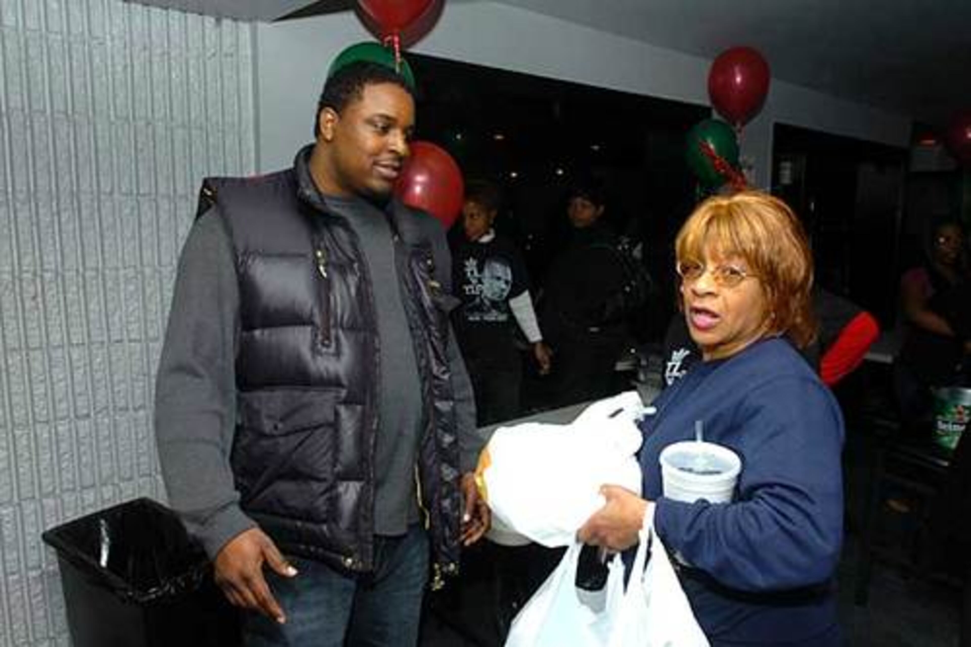 Big Kuntry and T.I.'s mother, Violeta Morgan, at T.I.'s Christmas giveaway at Club Crucial.