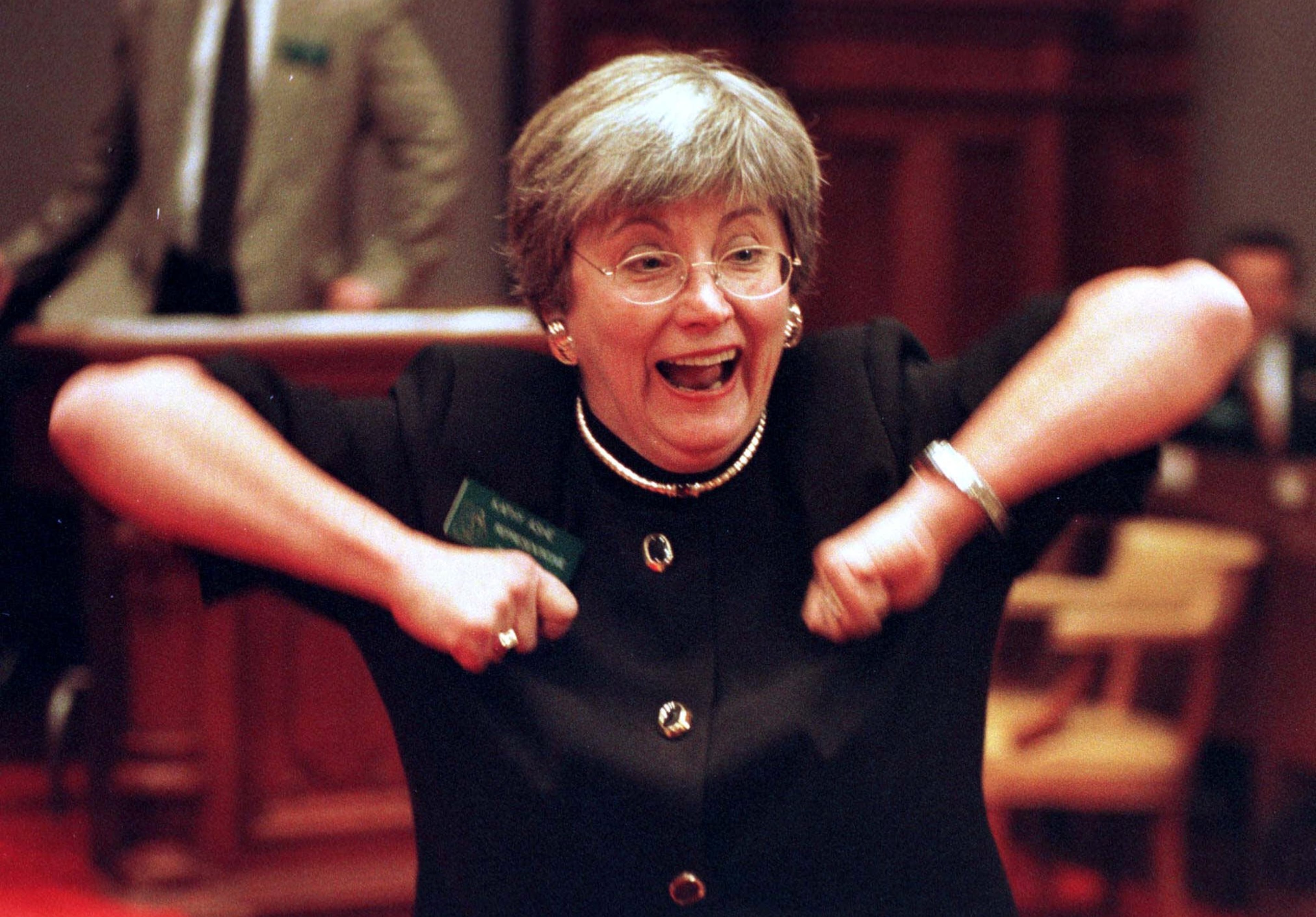 Rep. Kathy Ashe, R-Atlanta, does the 'Dirty Bird' on the floor of the state House in Atlanta on Friday, Jan. 15, 1999. Ashe suggested the legislature do the 'Dirty Bird' to wish the Falcons good luck in their NFC Championship matchup against the Minnesota Vikings. (AP Photo/Alan Mothner)