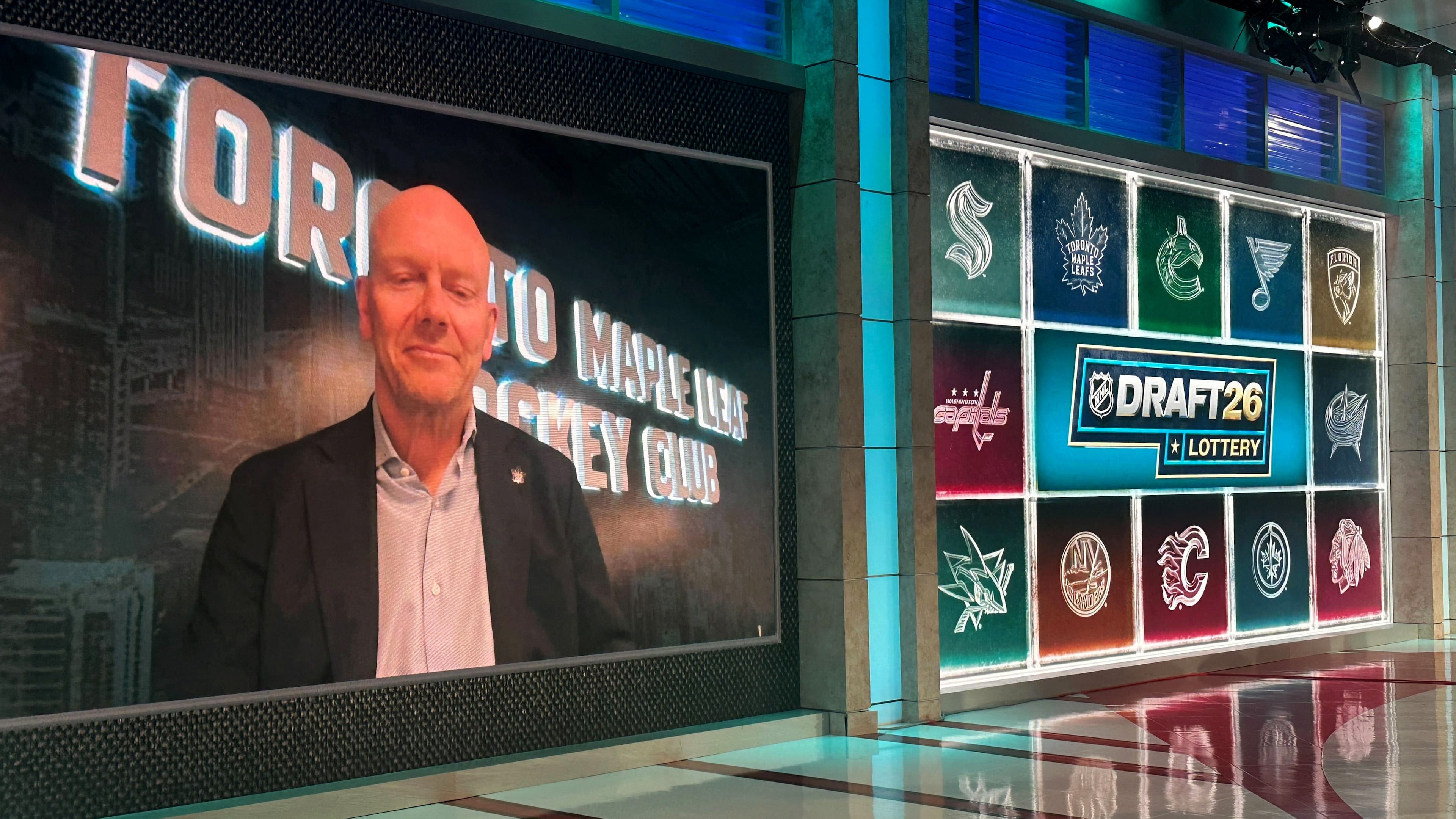 Toronto Maple Leafs executive Mats Sundin appears on a video screen after the team he just joined won the NHL draft lottery for the first pick, drawn at NHL Network studio in Secaucus, New Jersey, on Tuesday, May 5, 2026. (AP Photo/Stephen Whyno)