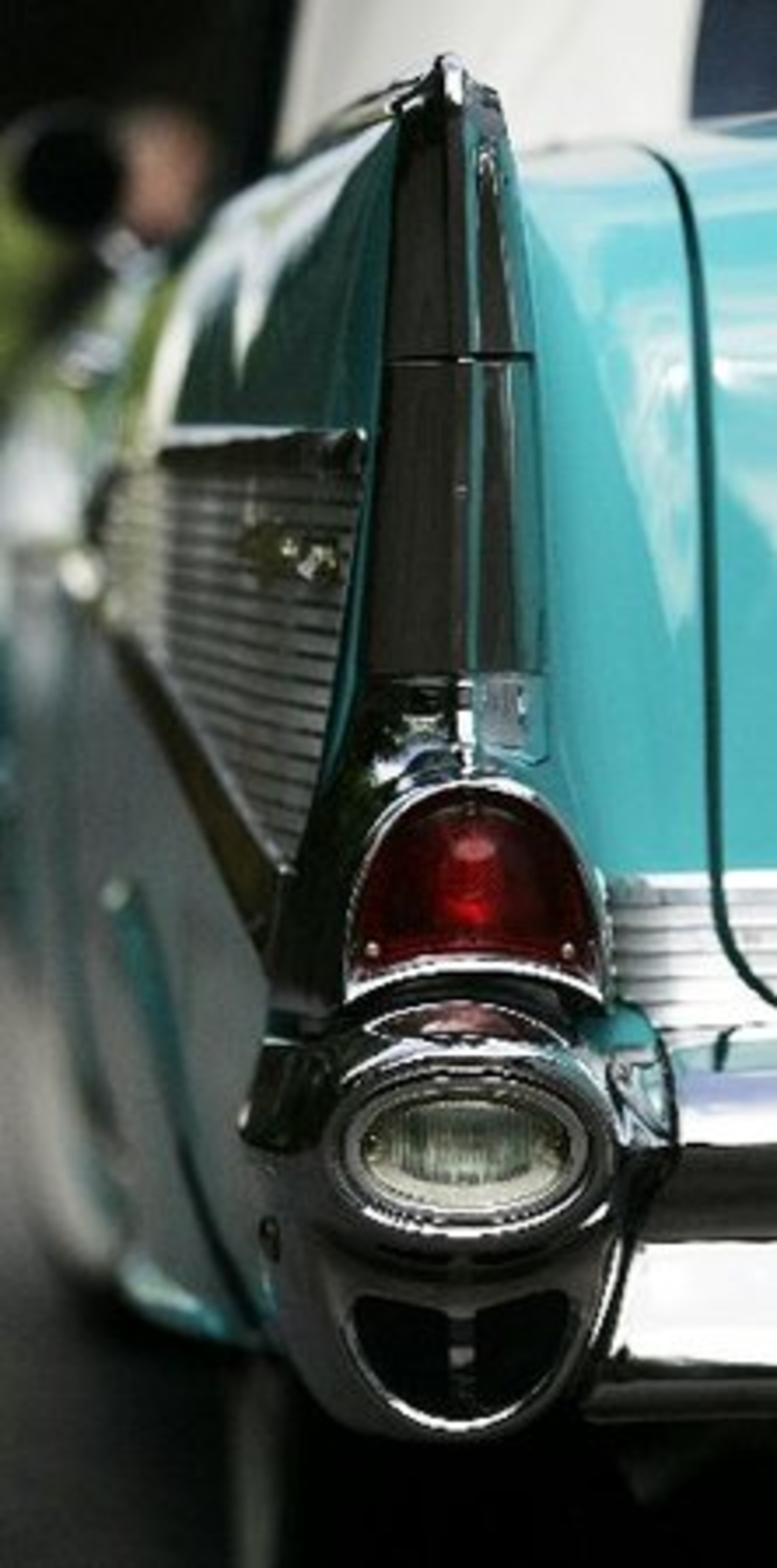 This is the 50th anniversary of the 57 Chevy. This is a 1957 Bel Air Convertible with 283 cu. in. Power Pac 4 barrel Automatic in Tropical Turquoise, offered by Fraser Dante Limited, a Roswell dealership primarily involved with classic cars, for $84,950. In the car is Tevie Dante Fraser, who owns the dealership with Thomas Fraser.