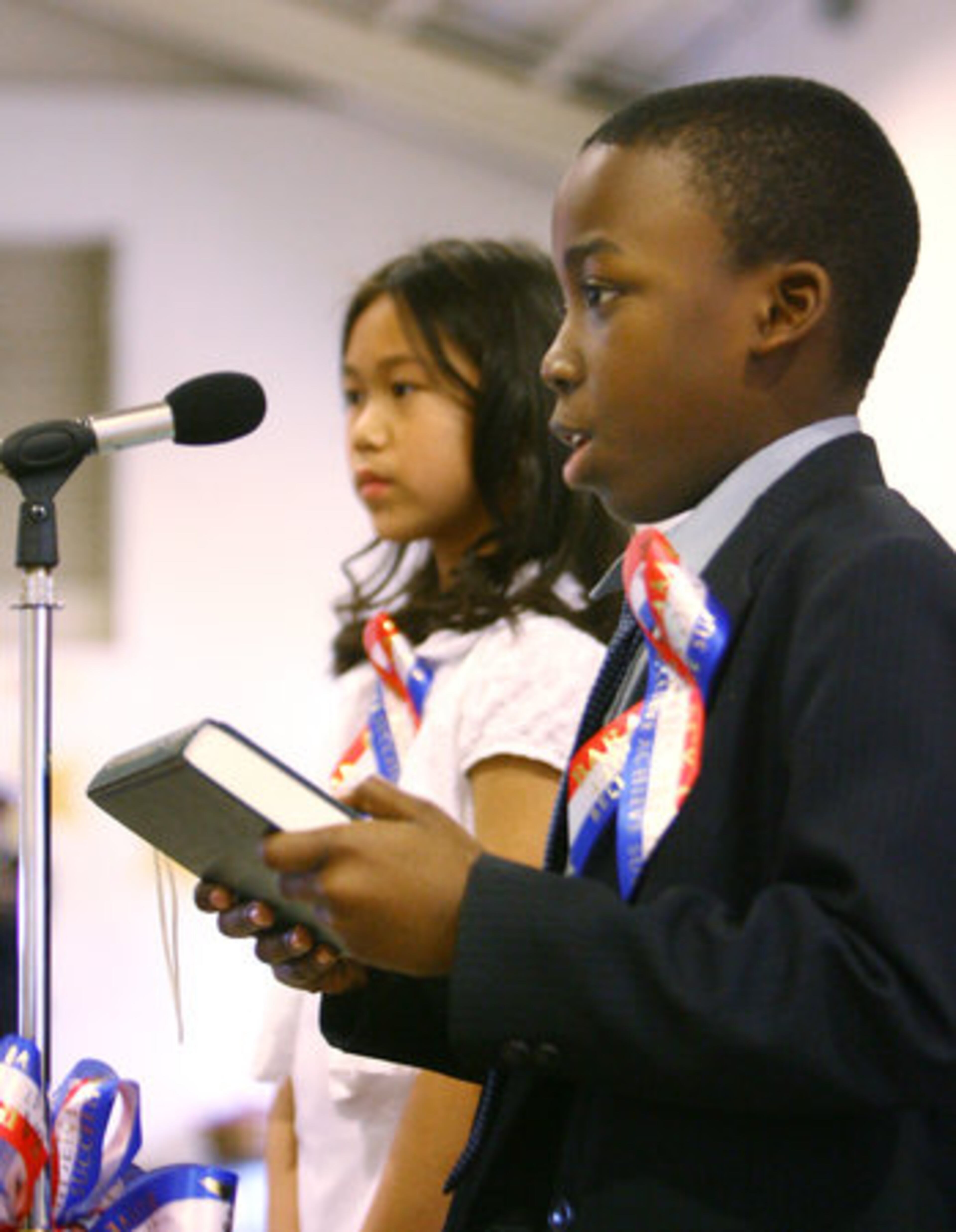 William Cutts (foreground), playing the role of President Barack Obama, gives his inaugural address as Selena Bounyavong (at left background), playing the role of Michelle Obama, listens as students at Chesney Elementary School in Duluth staged their own presidential swearing-in ceremony prior to the real thing Tuesday morning Jan. 20, 2009.