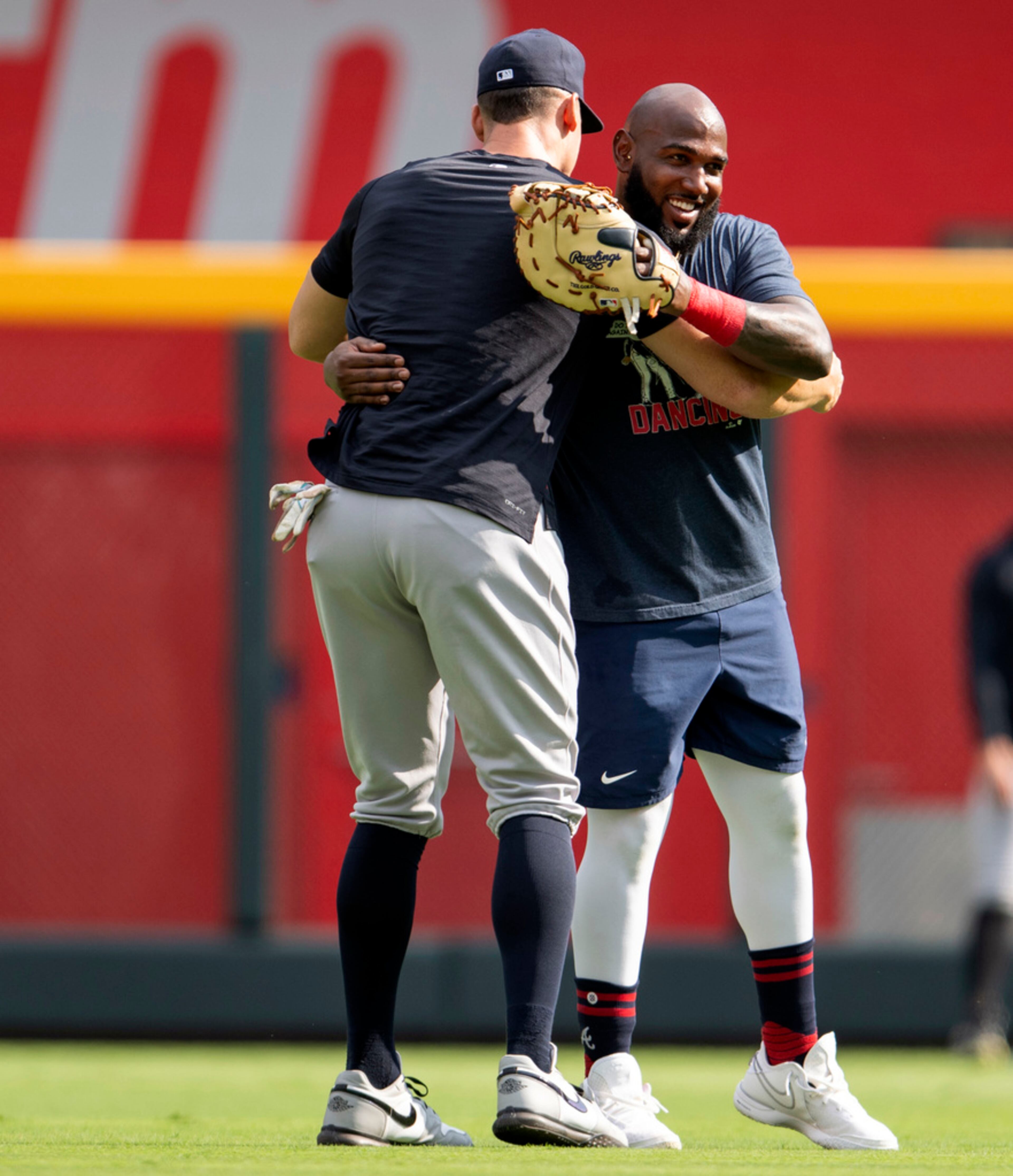 New York Yankees' Aaron Judge, left, embraces Atlanta Braves' Marcell Ozuna before a baseball game Monday, Aug. 14, 2023, in Atlanta. (AP Photo/Hakim Wright Sr.)