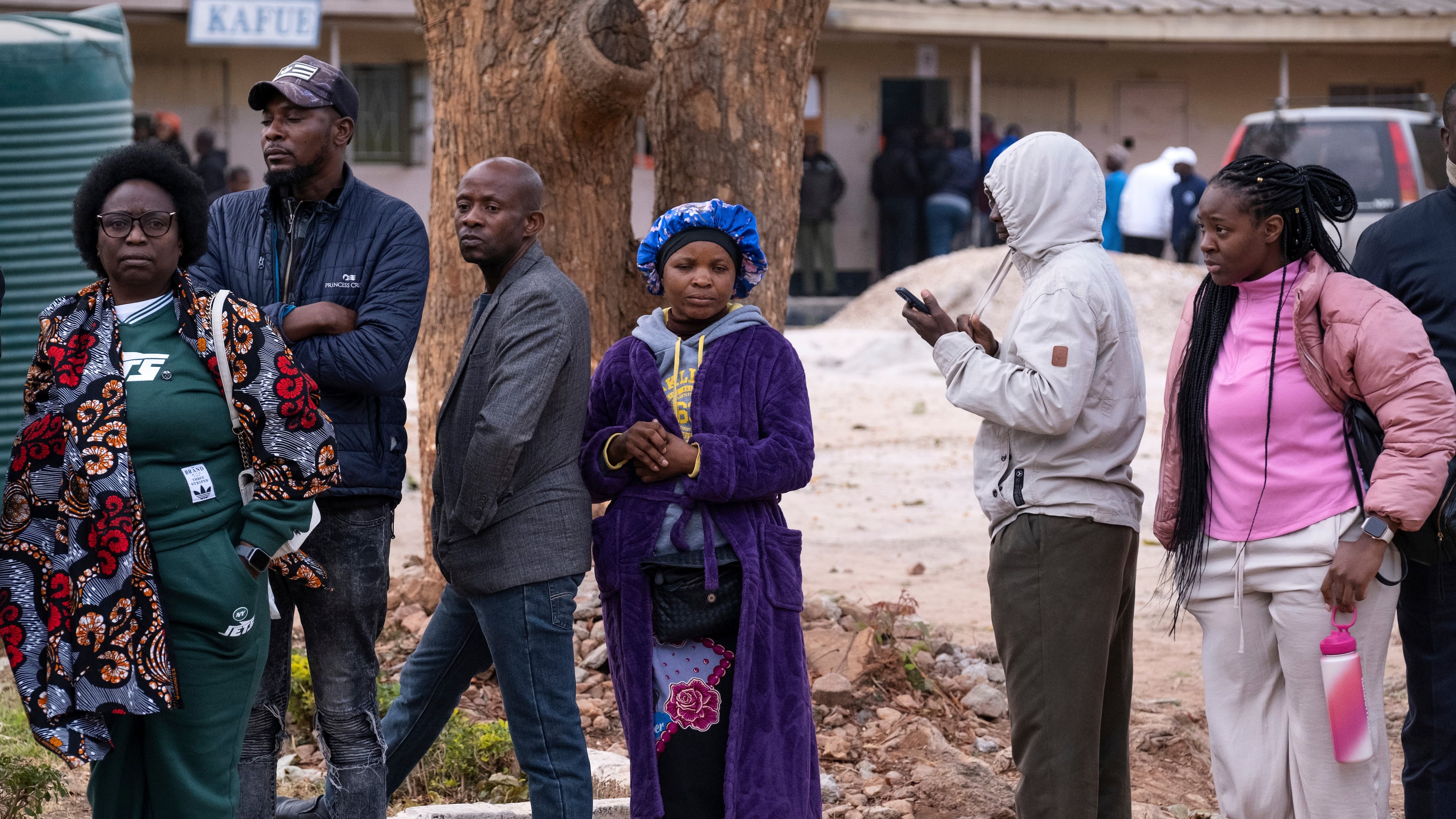 People queue up outside a polling station during a presidential election in Lusaka, Zambia, Thursday, Aug. 13, 2026. (AP Photo/Anita Reed)