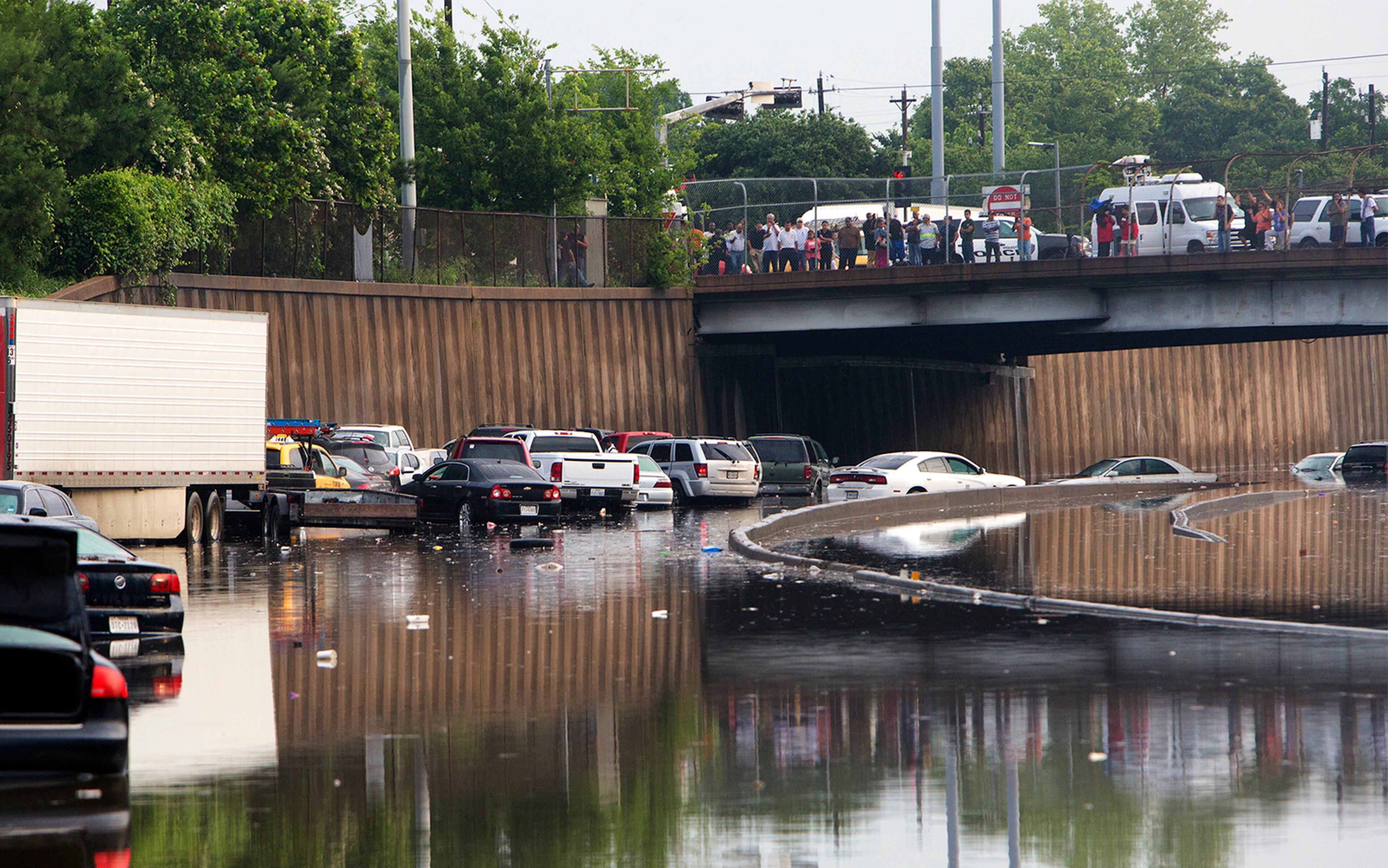 Motorists are stranded along I-45 along North Main in Houston after storms flooded the area, Tuesday, May 26, 2015. Overnight heavy rains caused flooding closing some portions of major highways in the Houston area. (Cody Duty/Houston Chronicle via AP)