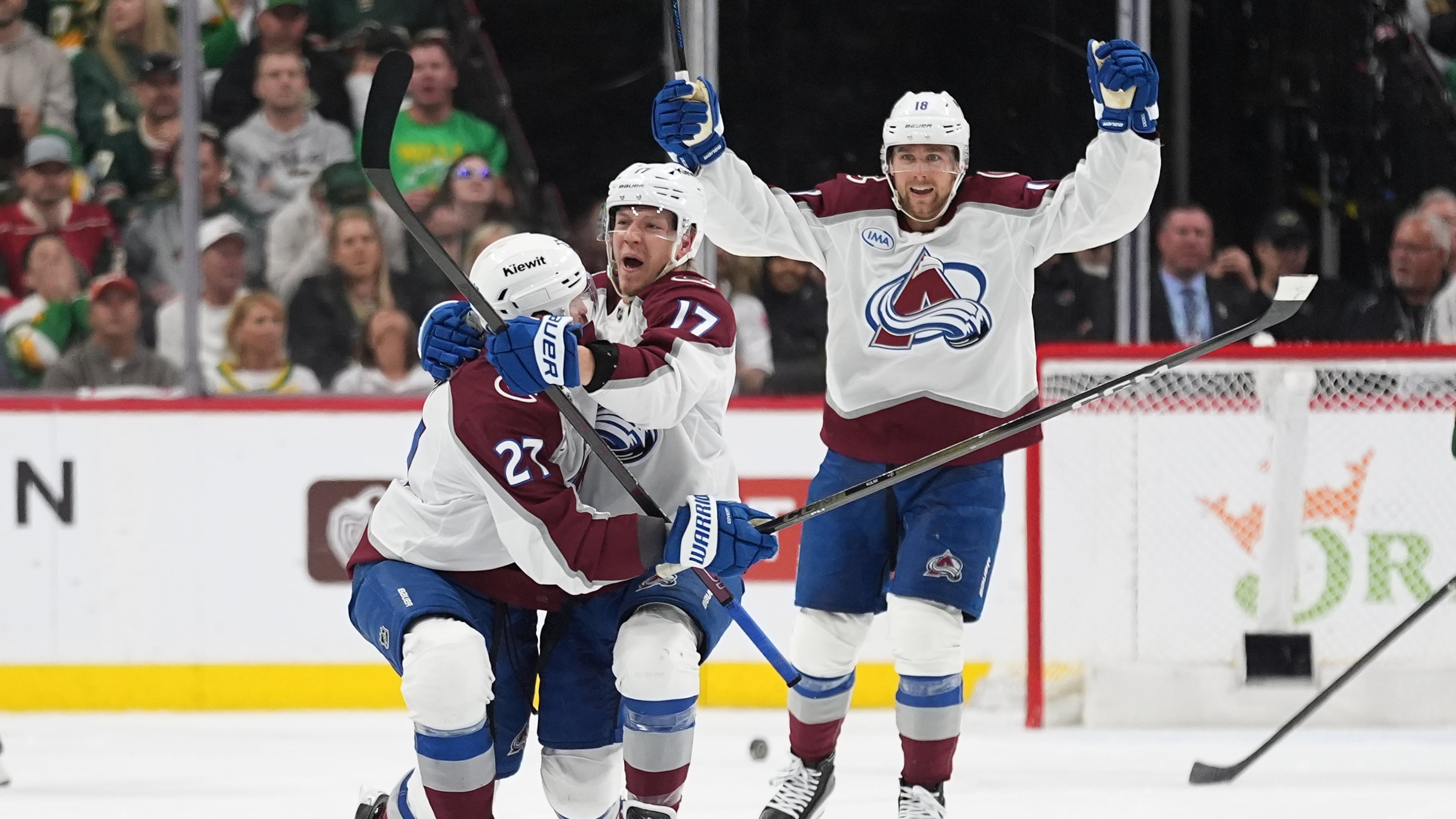 Colorado Avalanche center Parker Kelly, center, celebrates after scoring during the third period of Game 4 in an NHL Stanley Cup hockey second-round playoff series against the Minnesota Wild, Monday, May 11, 2026, in St. Paul, Minn. (AP Photo/Abbie Parr)