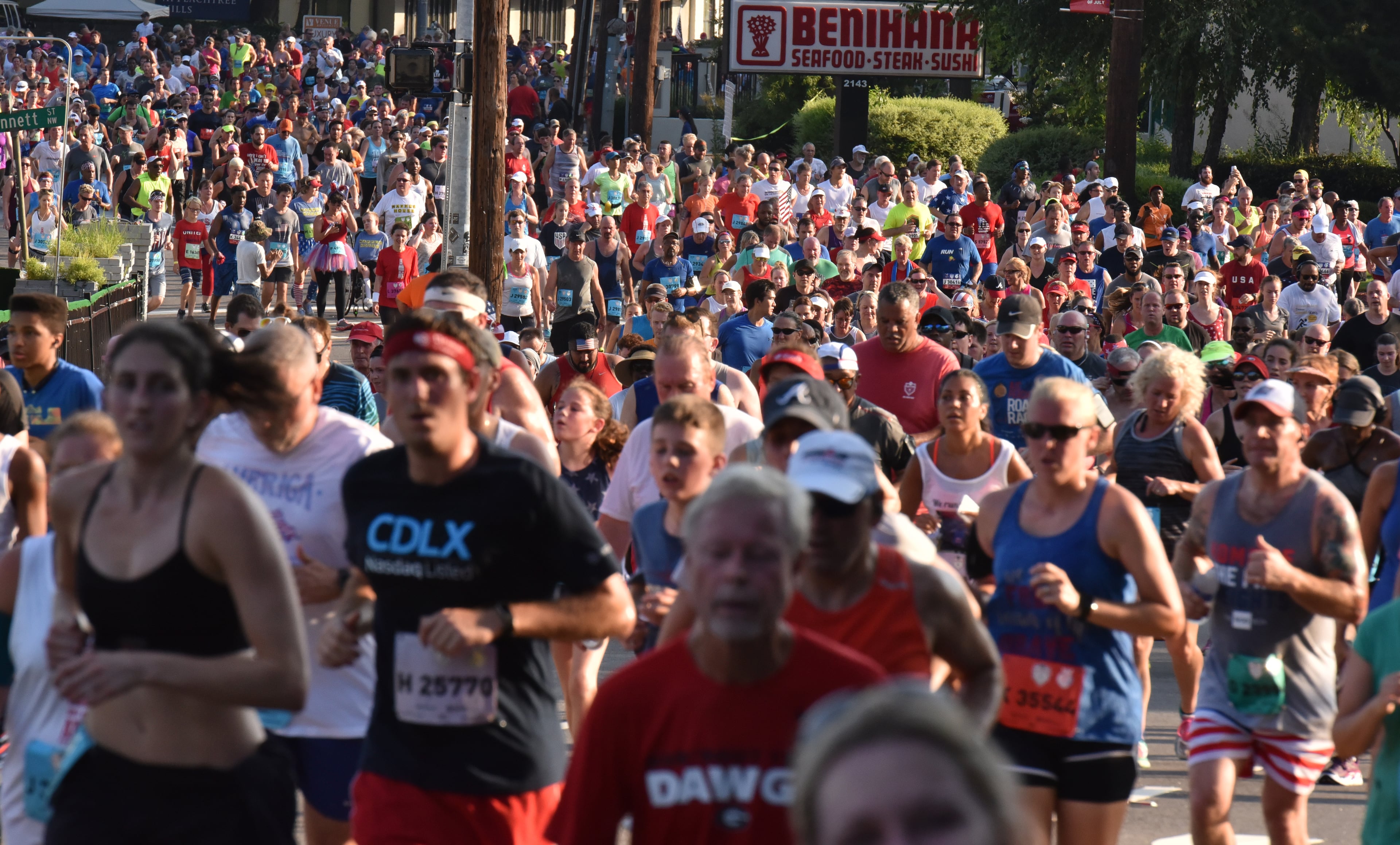 July 4, 2018 Atlanta - Runners approach Cardiac Hill during the AJC Peachtree Road Race on Wednesday, July 4, 2018. HYOSUB SHIN / HSHIN@AJC.COM