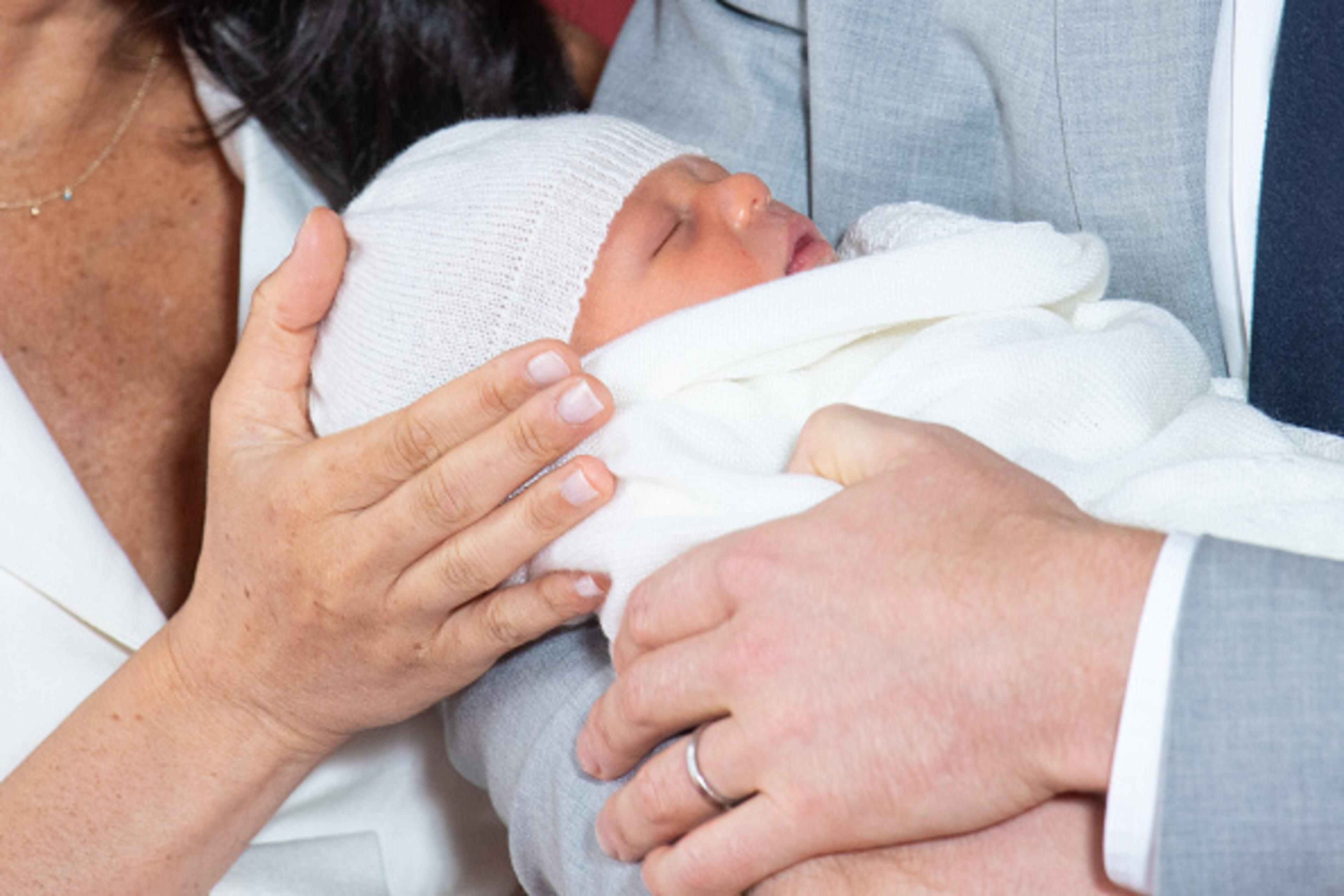 Prince Harry, Duke of Sussex and Meghan, Duchess of Sussex, pose with their newborn son during a photocall in St George's Hall at Windsor Castle on May 8, 2019 in Windsor, England. The Duchess of Sussex gave birth at 05:26 on Monday 06 May, 2019.
