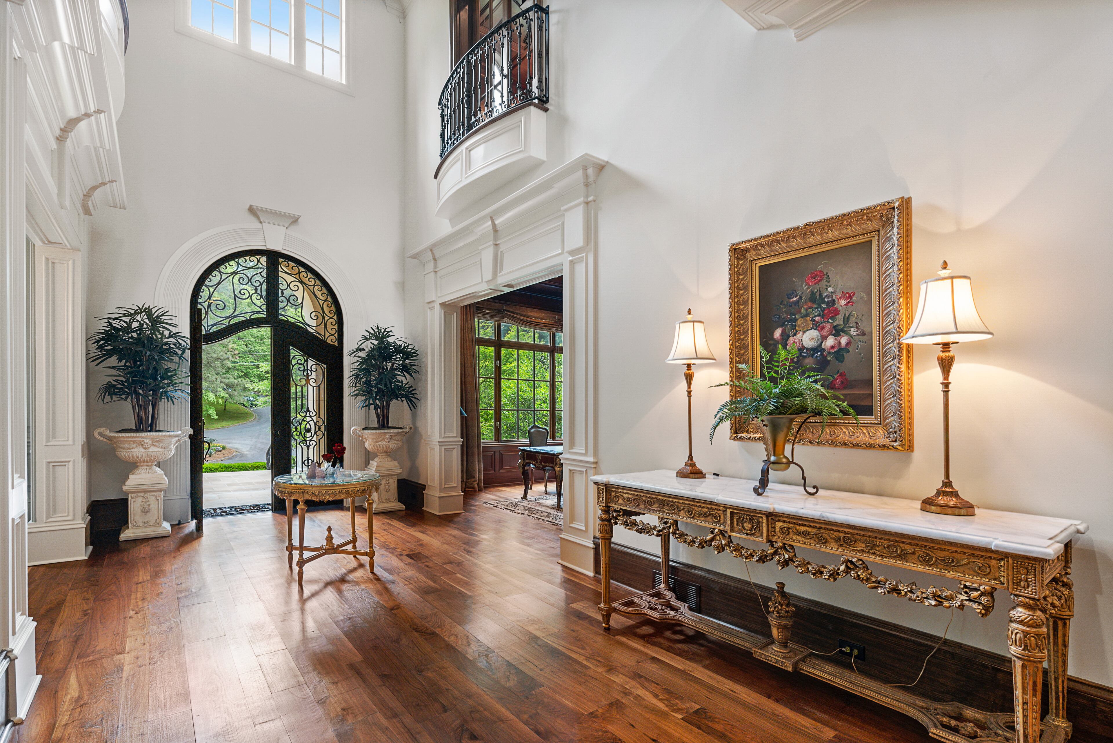 Grand two-story foyer with open views to living room. Text by Coldwell Banker Real Estate
