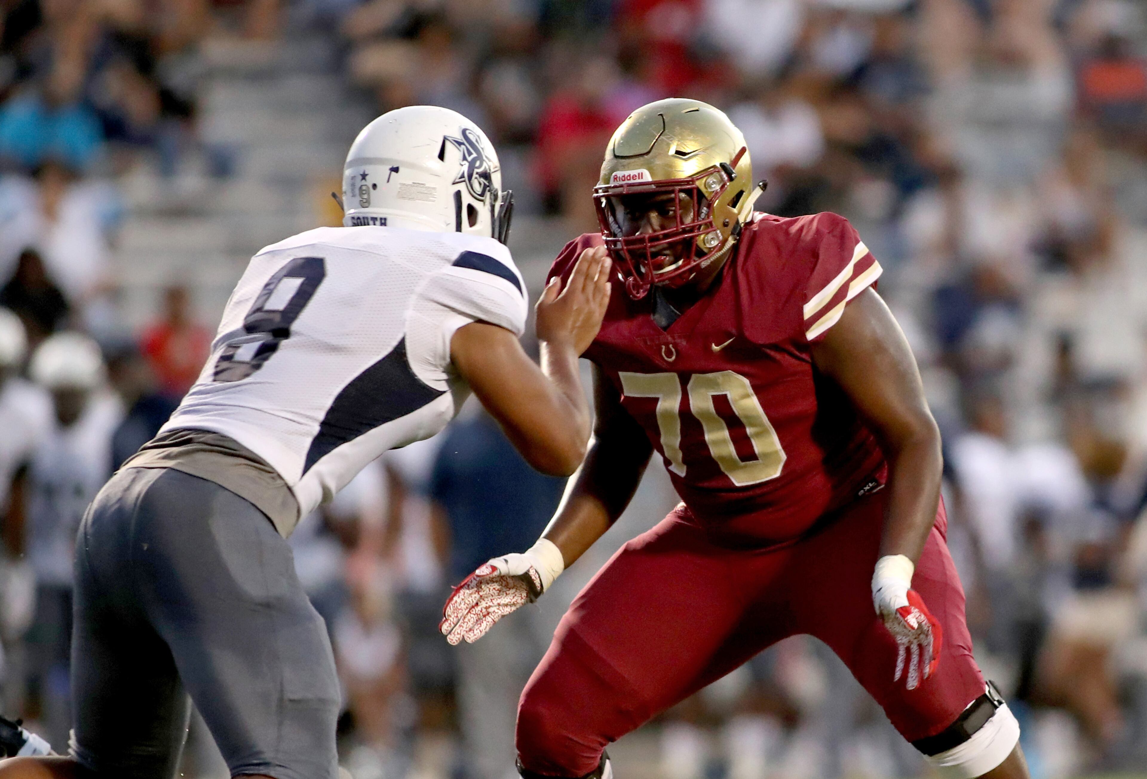 Brookwood offensive lineman Sean Hill (70) squares off against South Gwinnett defensive lineman Antonio Johnson (9) in the first half of Friday's game at Brookwood. (Jason Getz/Special)