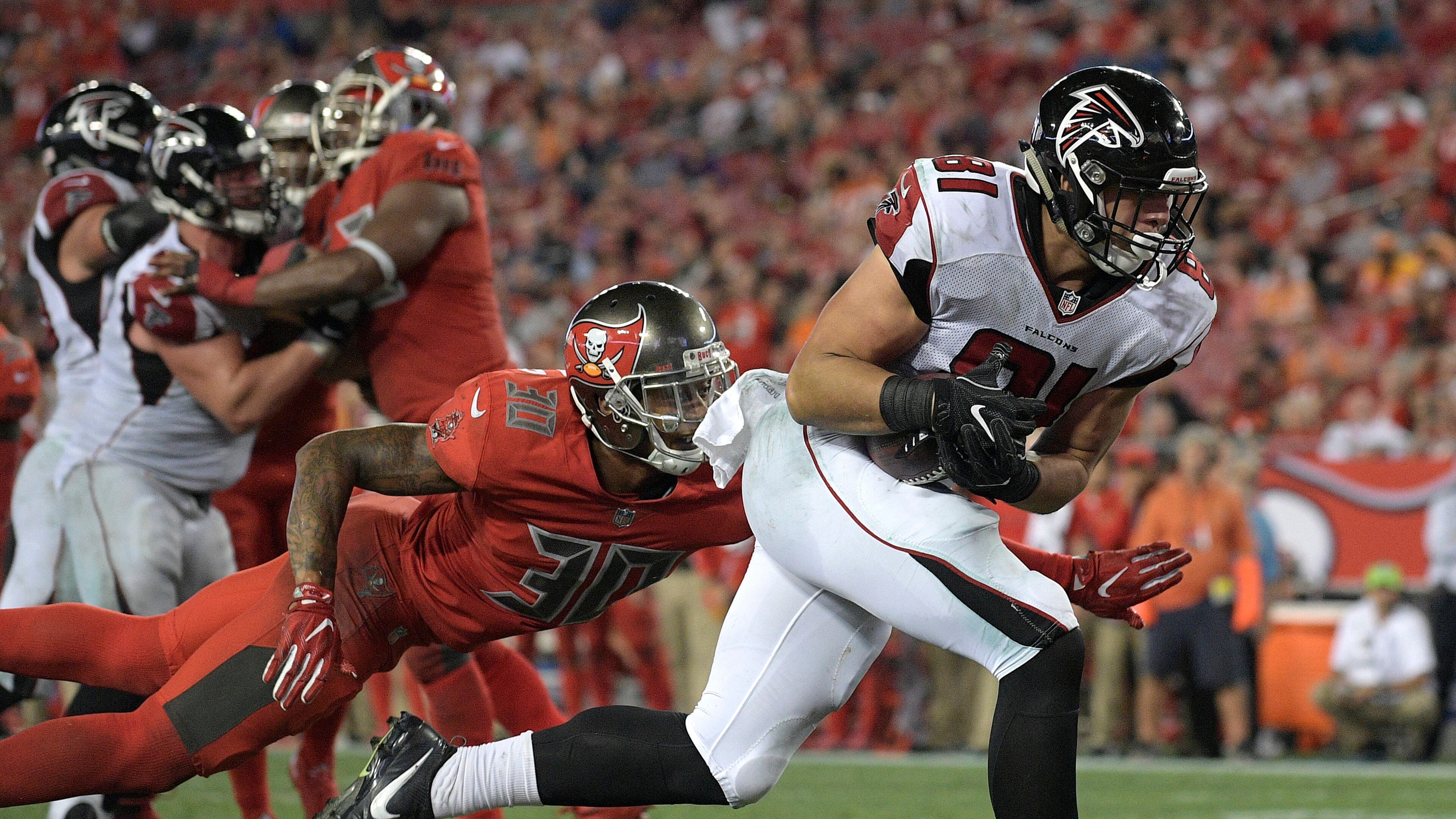 Atlanta Falcons tight end Austin Hooper (81) beats Tampa Bay Buccaneers free safety Bradley McDougald (30) on a 2-yard touchdown reception during the fourth quarter of an NFL football game Thursday, Nov. 3, 2016, in Tampa, Fla. (AP Photo/Phelan Ebenhack)