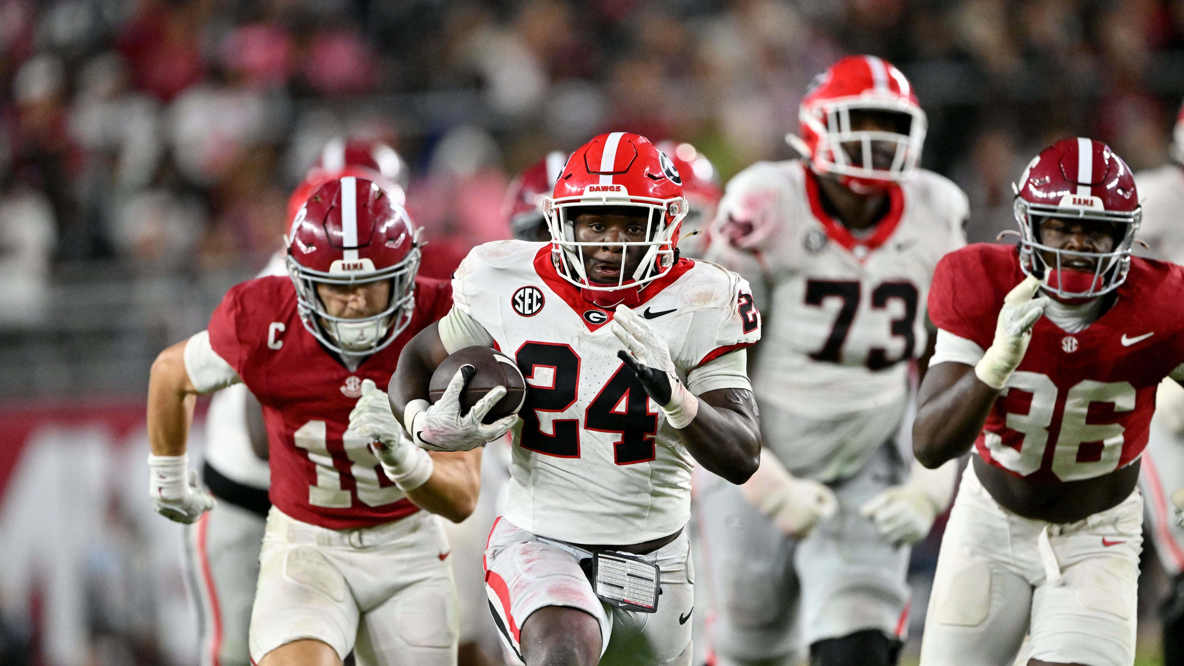 Georgia running back Bo Walker (center) runs the ball during the second half Saturday, Oct. 10, 2026, at Bryant-Denny Stadium in Tuscaloosa, Alabama. Walker had 10 carries for 69 yards. (Hyosub Shin/AJC)