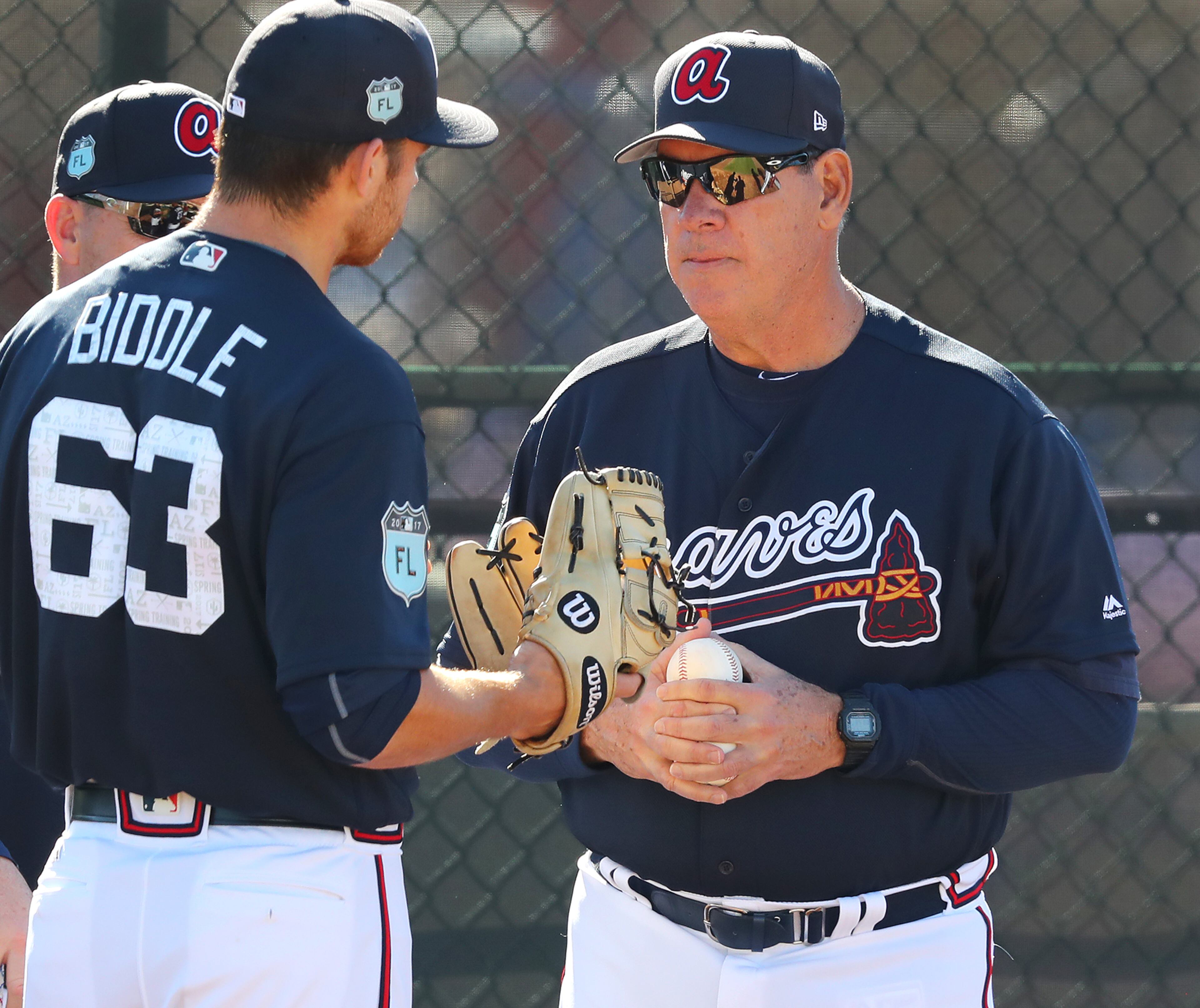 February 16, 2017, Lake Buena Vista, FL: Braves pitching coach Chuck Hernandez works with Jesse Biddle in the bullpen at Champion Stadium on Thursday Feb. 16, 2017, at the ESPN Wide World of Sports in Lake Buena Vista. Curtis Compton/ccompton@ajc.com