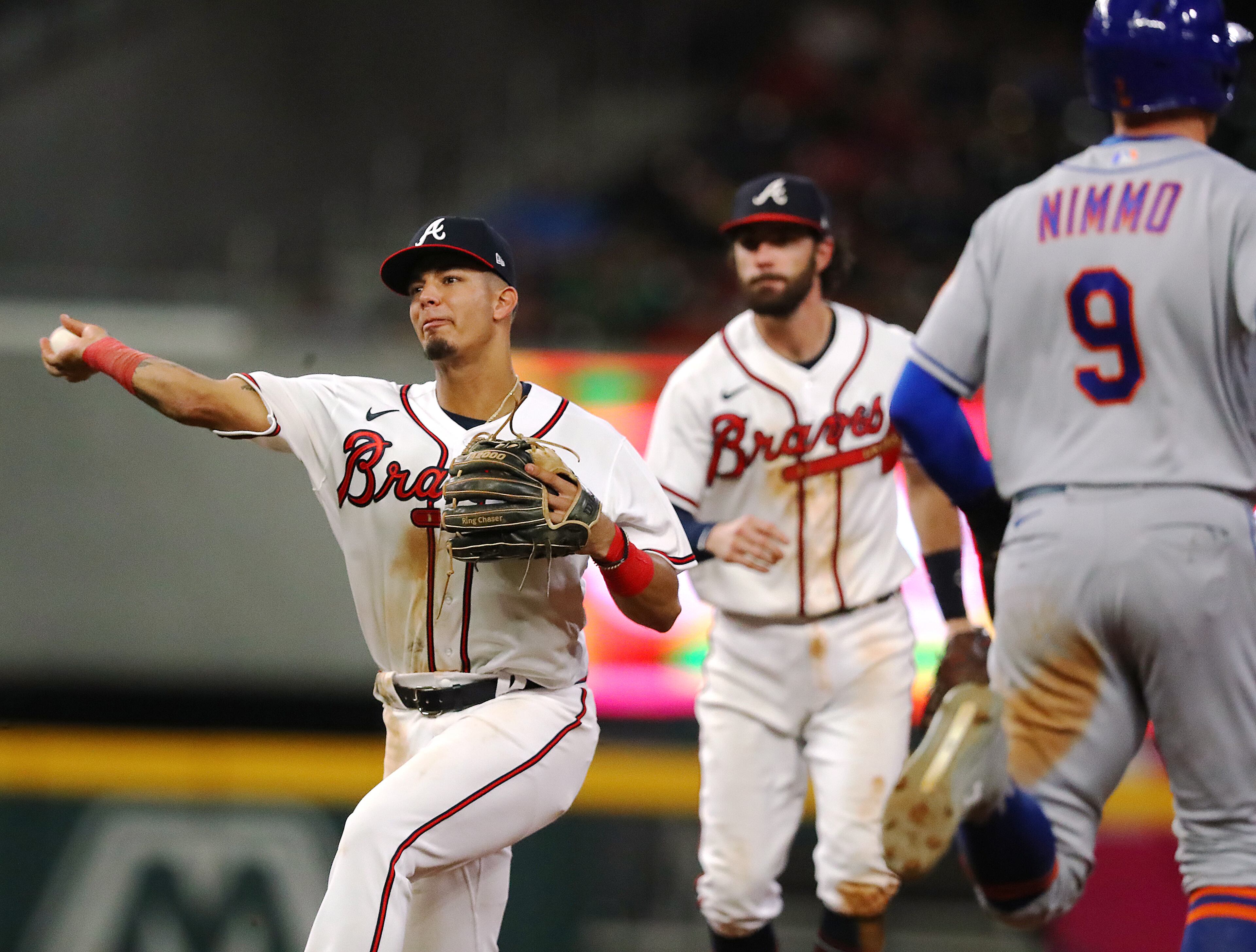Braves second baseman Vaughn Grissom (left) turns a double play past New York Mets Brandon Nimmo on a ground ball Starling Marling to Dansby Swanson (center) during the ninth inning in a MLB baseball game on Tuesday, August 16, 2022, in Atlanta. The double play helped the Braves hold on to the 5-0 shutout. “Curtis Compton / Curtis Compton@ajc.com