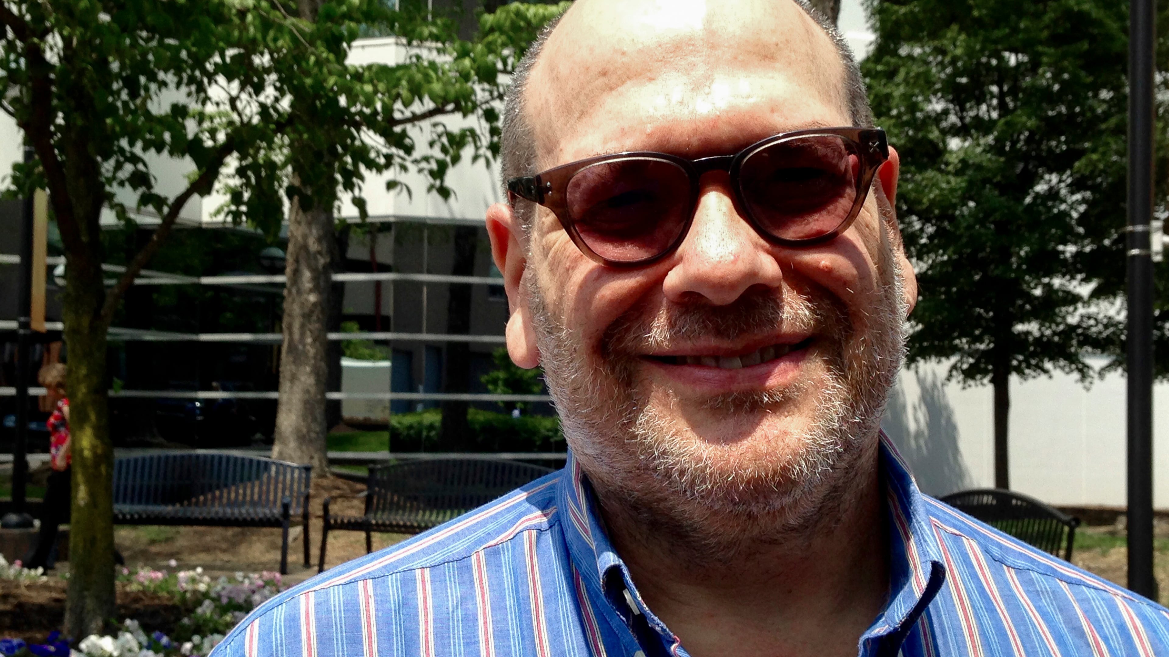 Daniel Ralph Heyman, 54, left, speaks to a reporter in Charleston, W. Va., on Wednesday, May 10, 2017, about his arrest by capitol police on Monday. Police arrested the journalist who they said was trying "aggressively" to get past Secret Service agents and yelling questions at U.S. Health and Human Services Secretary Tom Price during his visit to the state. (AP Photo/John Raby)