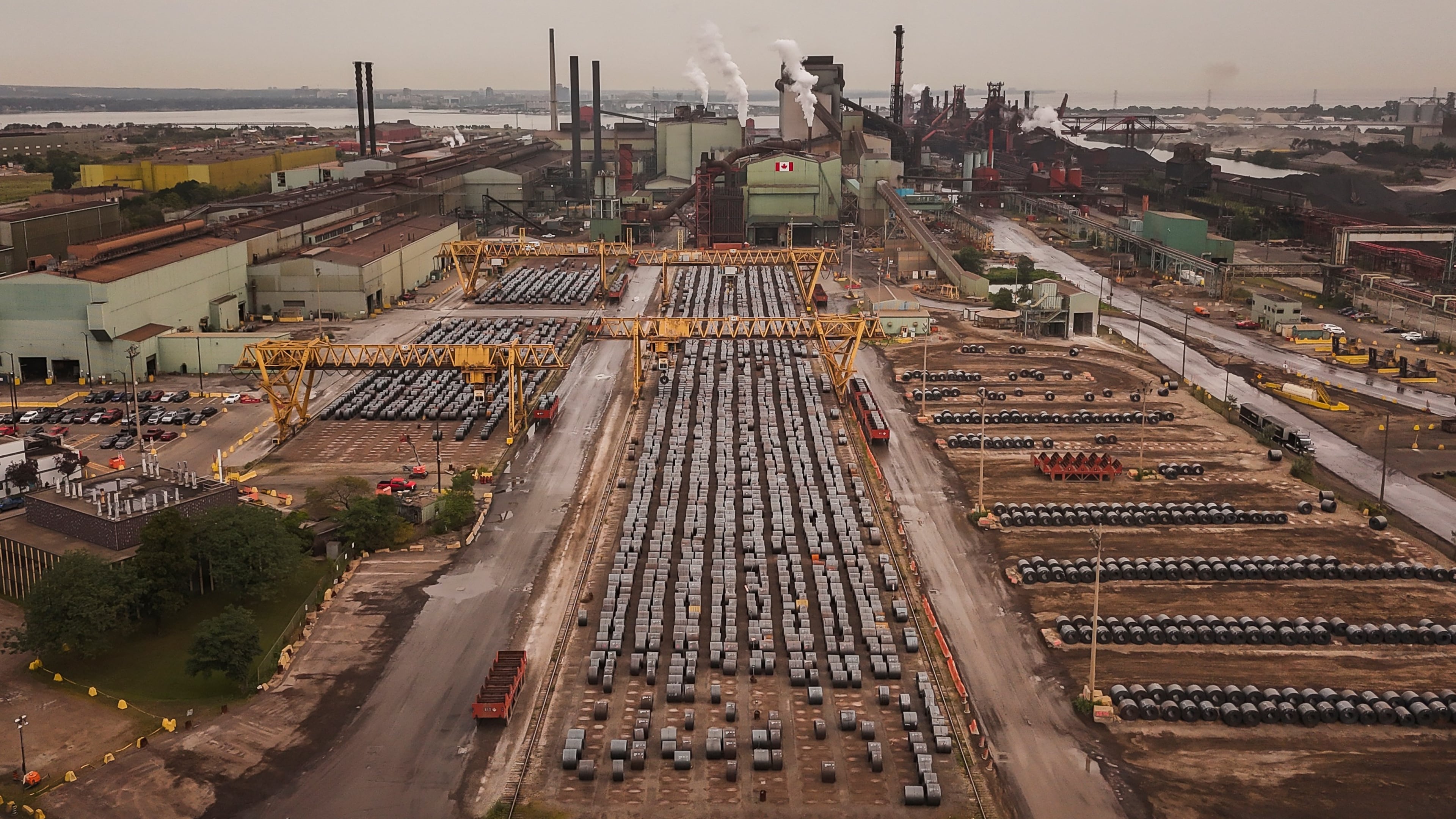 Rolled coils of steel sit in the yard at the ArcelorMittal Dofasco steel plant in Hamilton, Ont. on Thursday, Aug. 20, 2026. (Nick Iwanyshyn /The Canadian Press via AP)