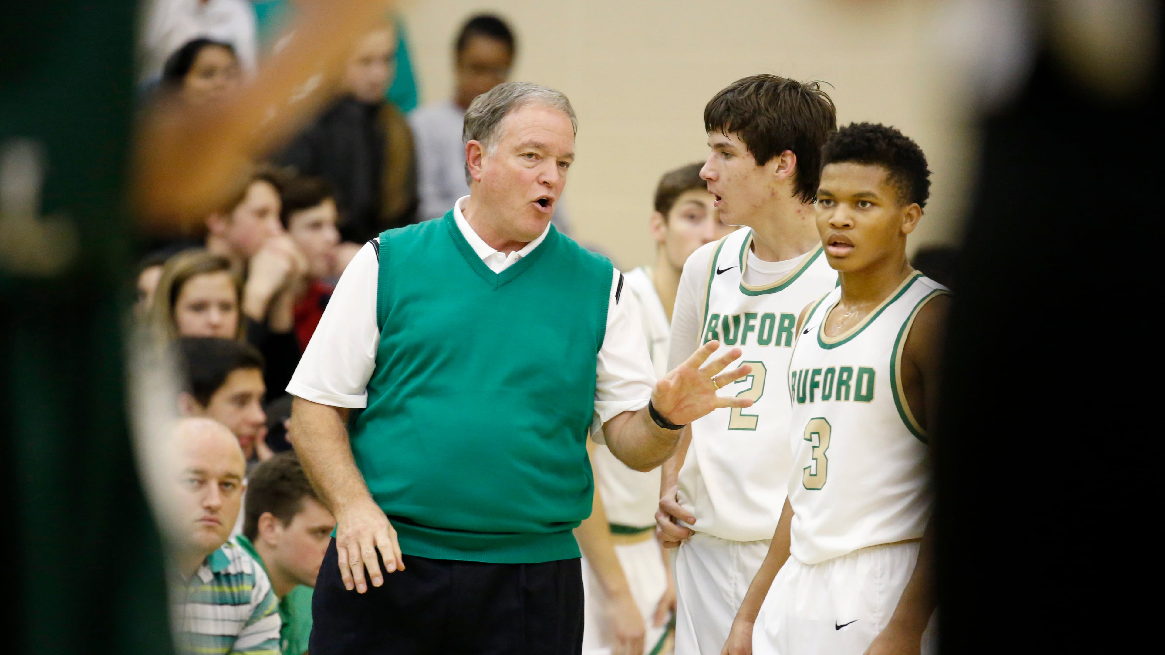 Buford coach Eddie Martin, left, talks with guards Dawson Wehunt (2) and Alex Jones (3) during a break from their game against North Hall at Buford High School Friday, January 15, 2016, in Buford, Ga.. PHOTO / JASON GETZ