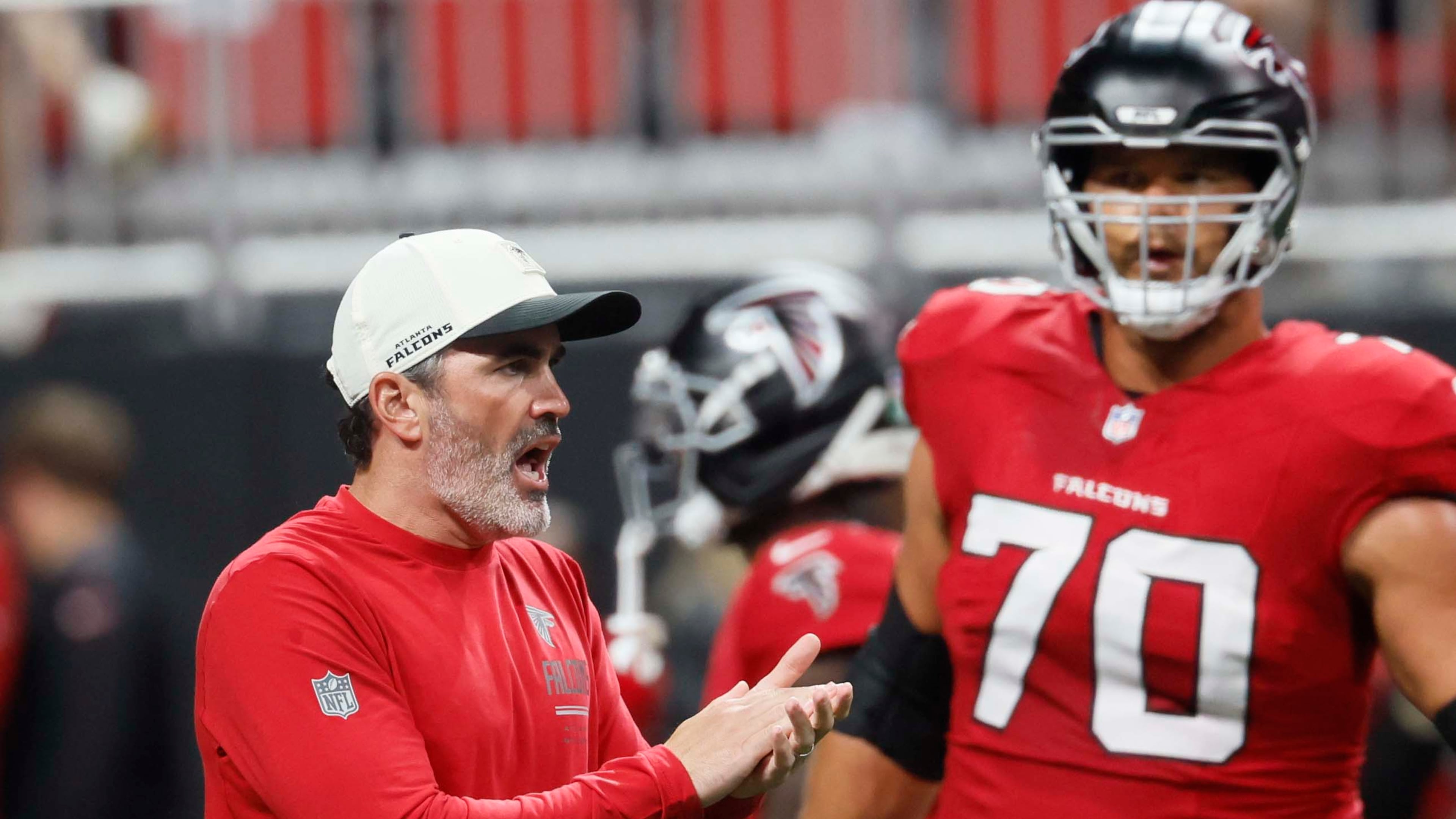 Falcons coach Kevin Stefanski cheers on his team during warmups before their game against the Baltimore Ravens at Mercedes-Benz Stadium on Sunday, Oct. 11, 2026, in Atlanta. (Miguel Martinez/AJC)
